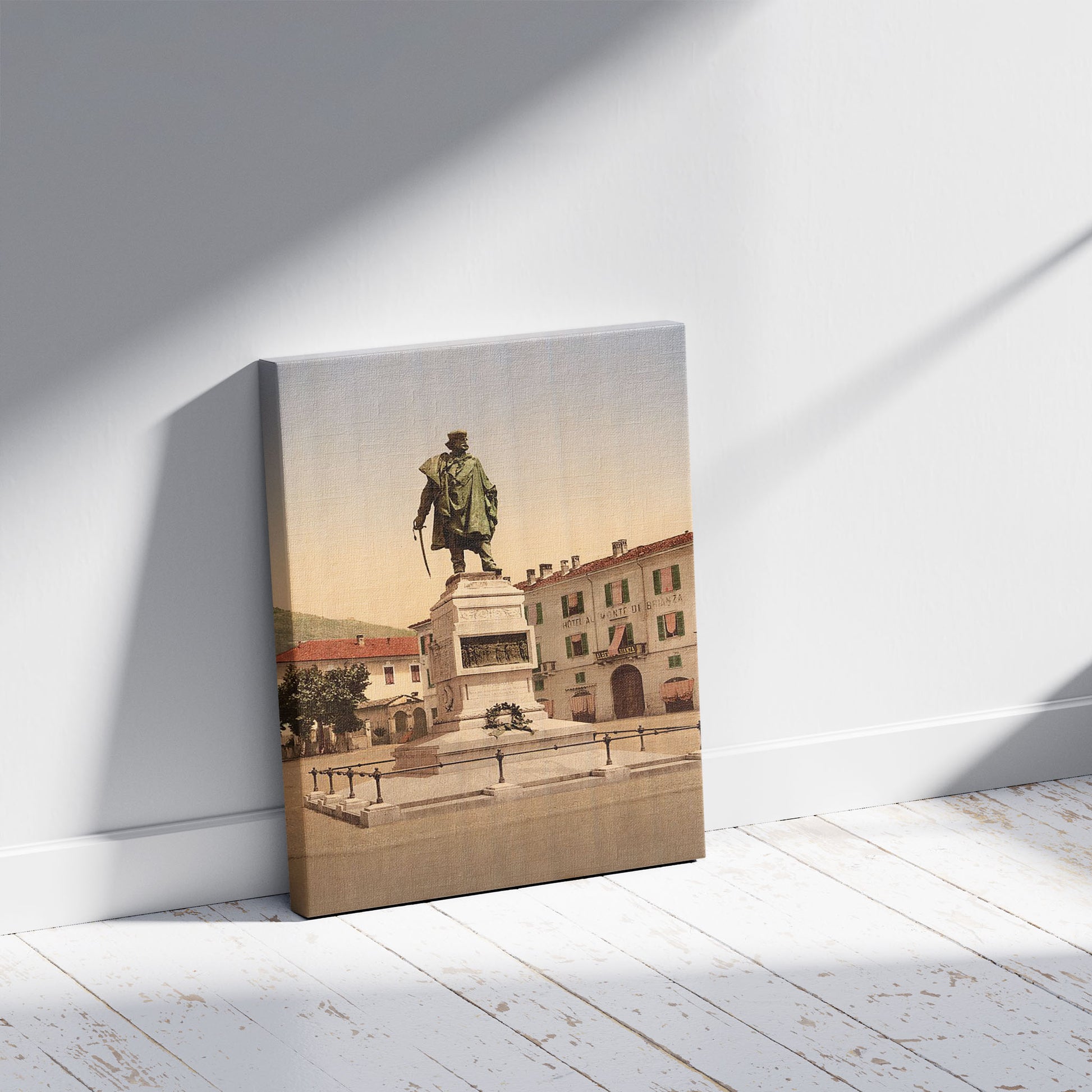 A picture of Como, Garibaldi Monument, Lake Como, Italy, a mockup of the print leaning against a wall