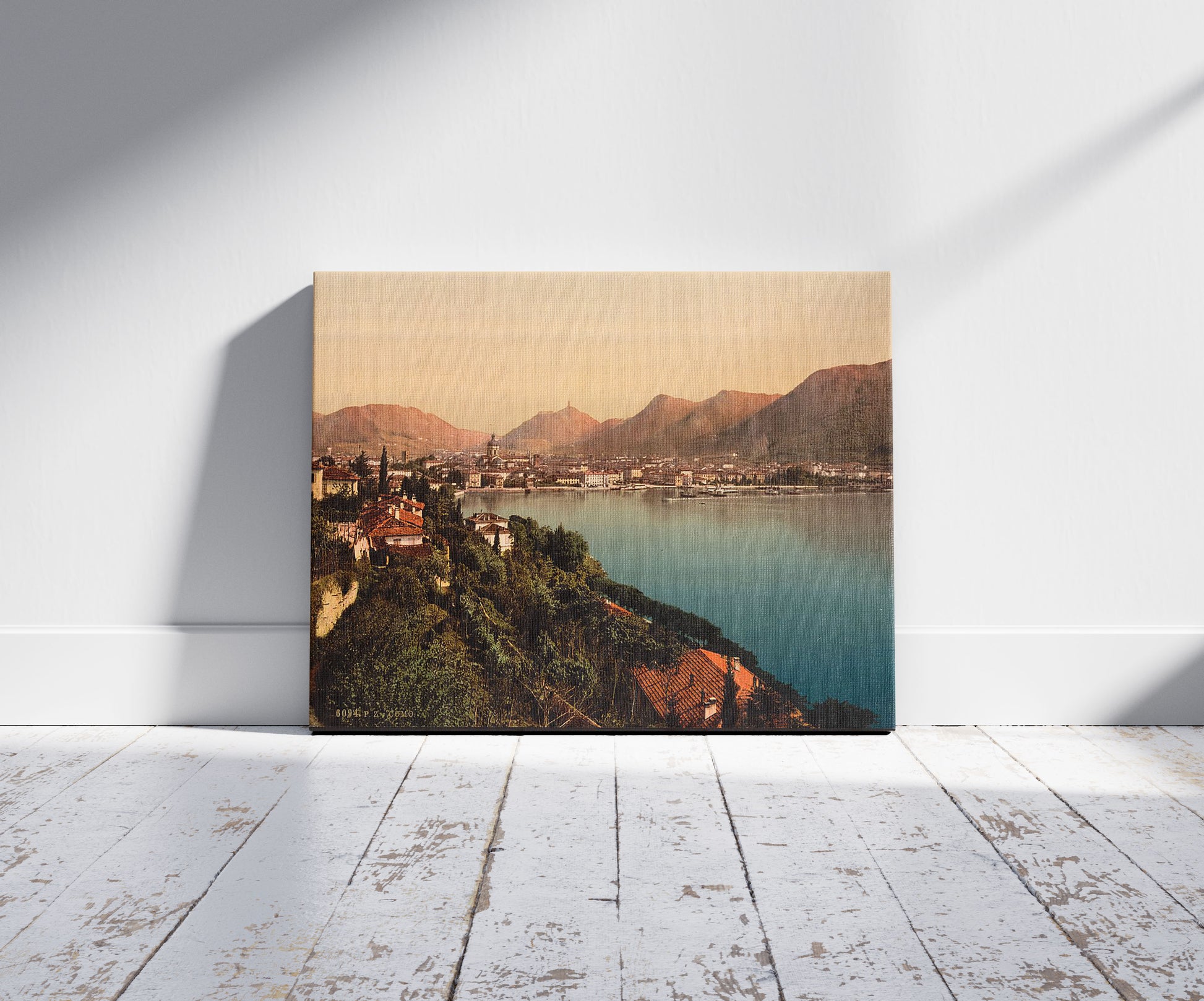 A picture of Como, general view, Lake Como, Italy, a mockup of the print leaning against a wall