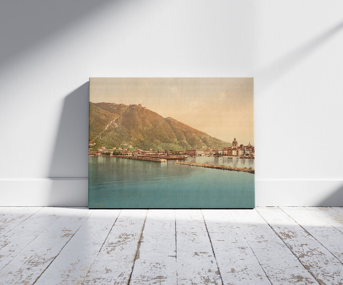 A picture of Como, the harbor, Lake Como, Italy, a mockup of the print leaning against a wall