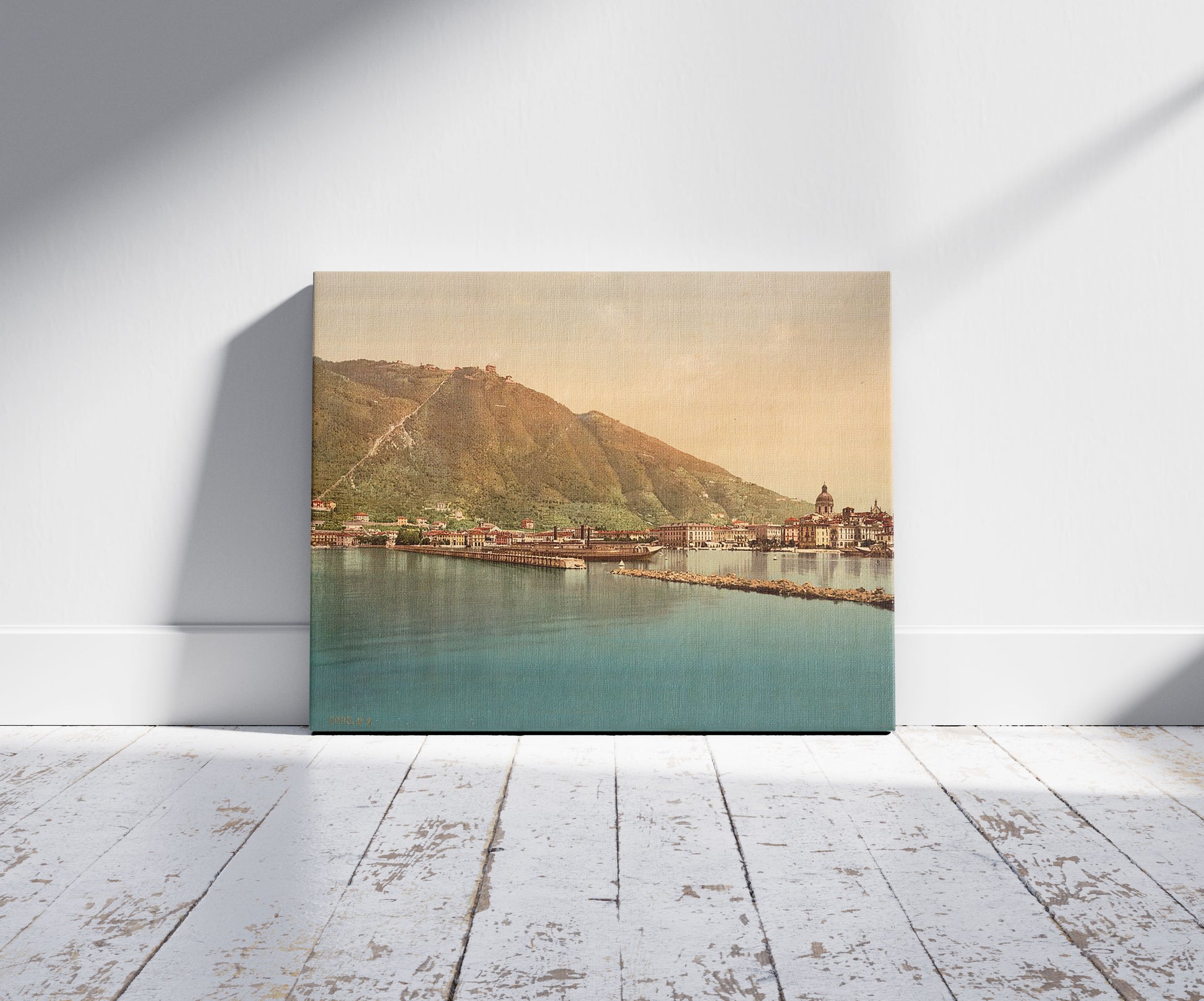 A picture of Como, the harbor, Lake Como, Italy, a mockup of the print leaning against a wall