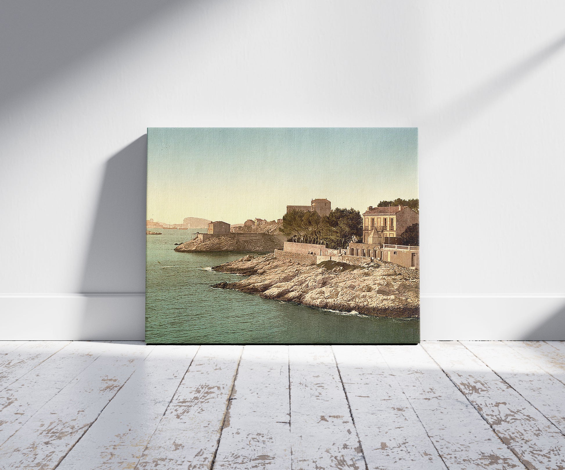 A picture of Corniche Road, Marseilles, France, a mockup of the print leaning against a wall