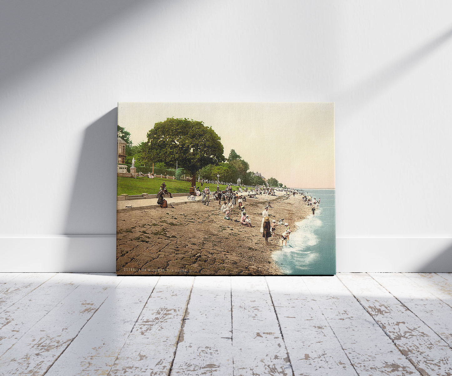 A picture of Cowes, the green, I., Isle of Wight, England, a mockup of the print leaning against a wall