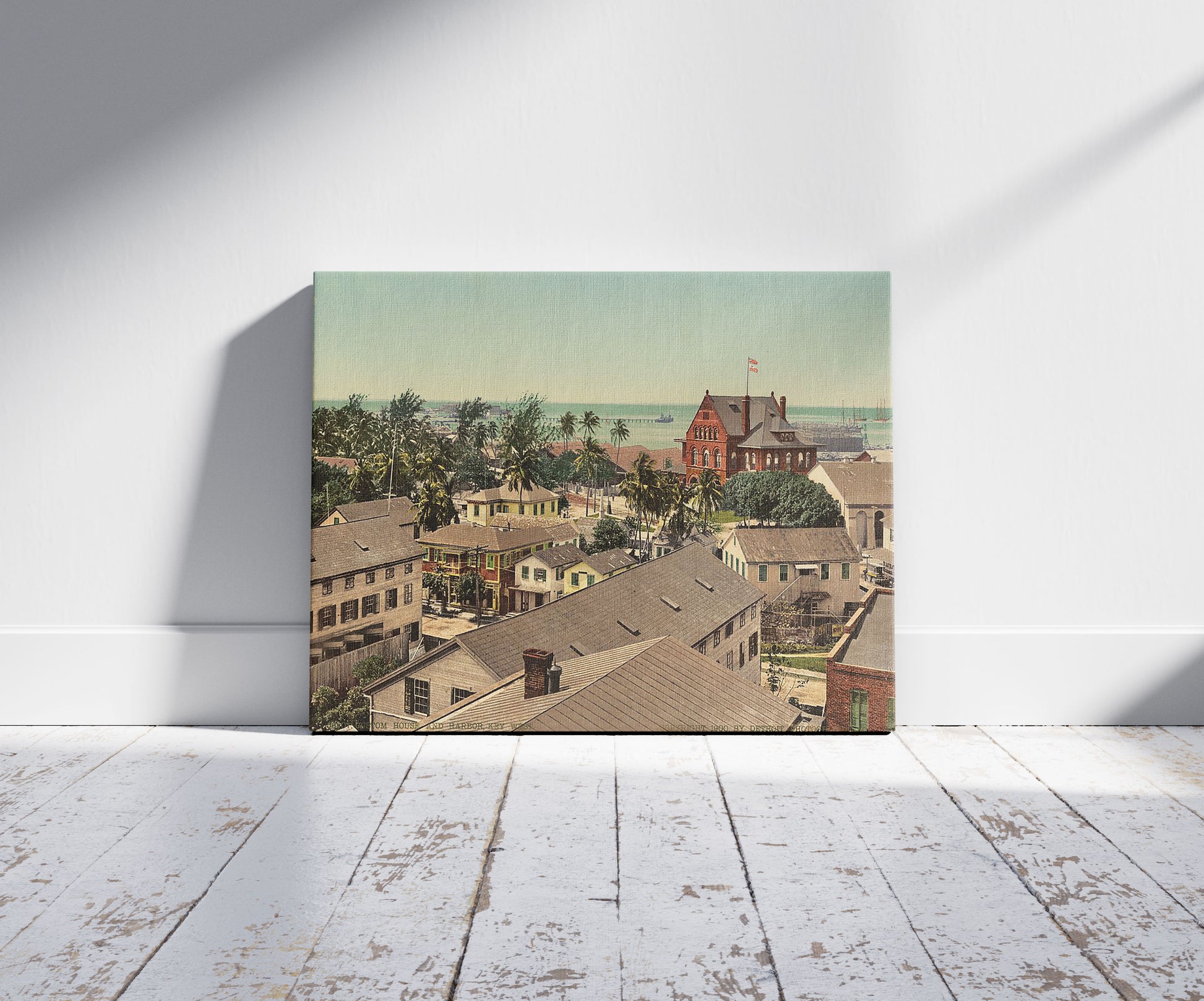 A picture of Custom House and harbor, Key West, a mockup of the print leaning against a wall