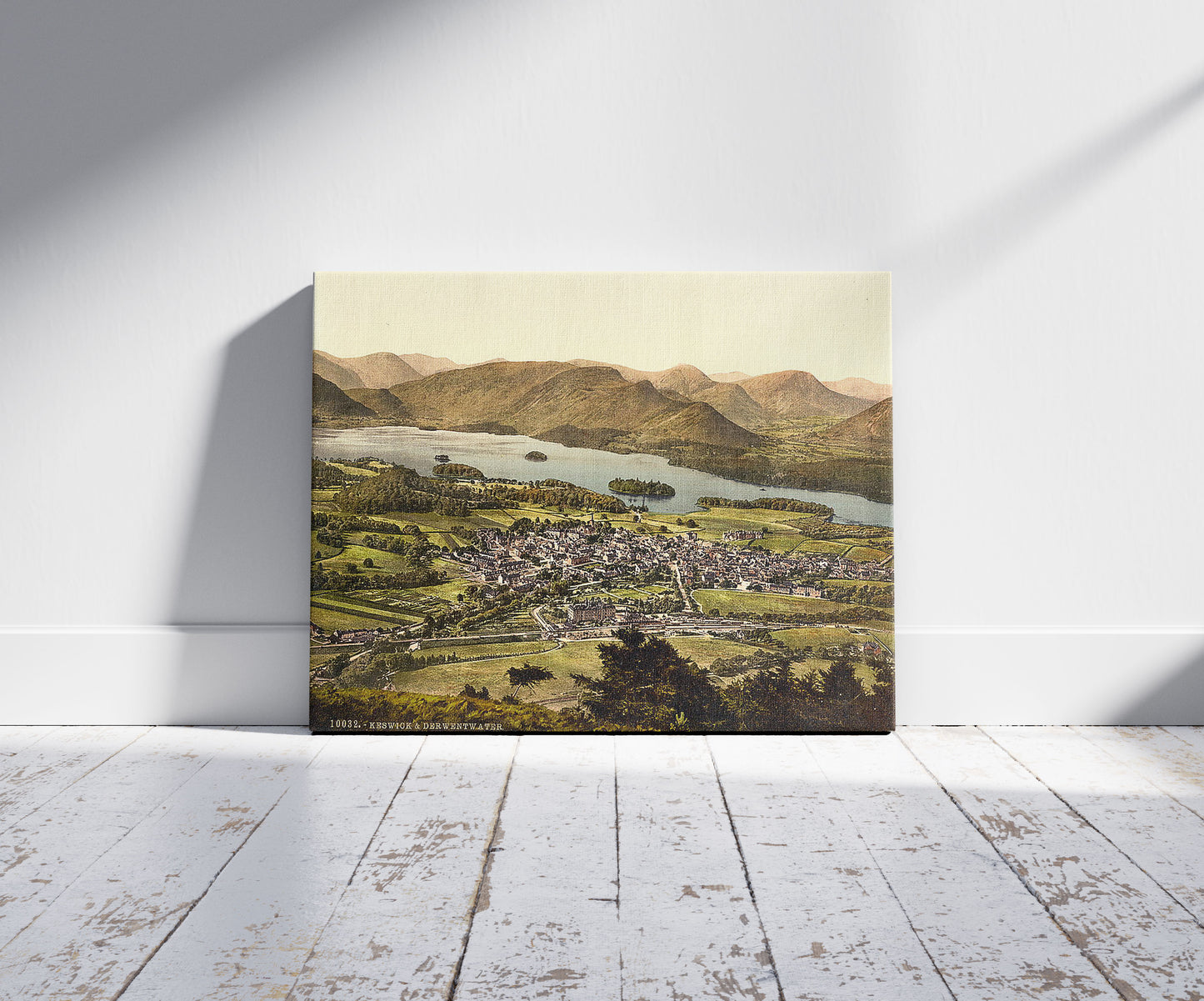 A picture of Derwentwater and Keswick, Lake District, England, a mockup of the print leaning against a wall