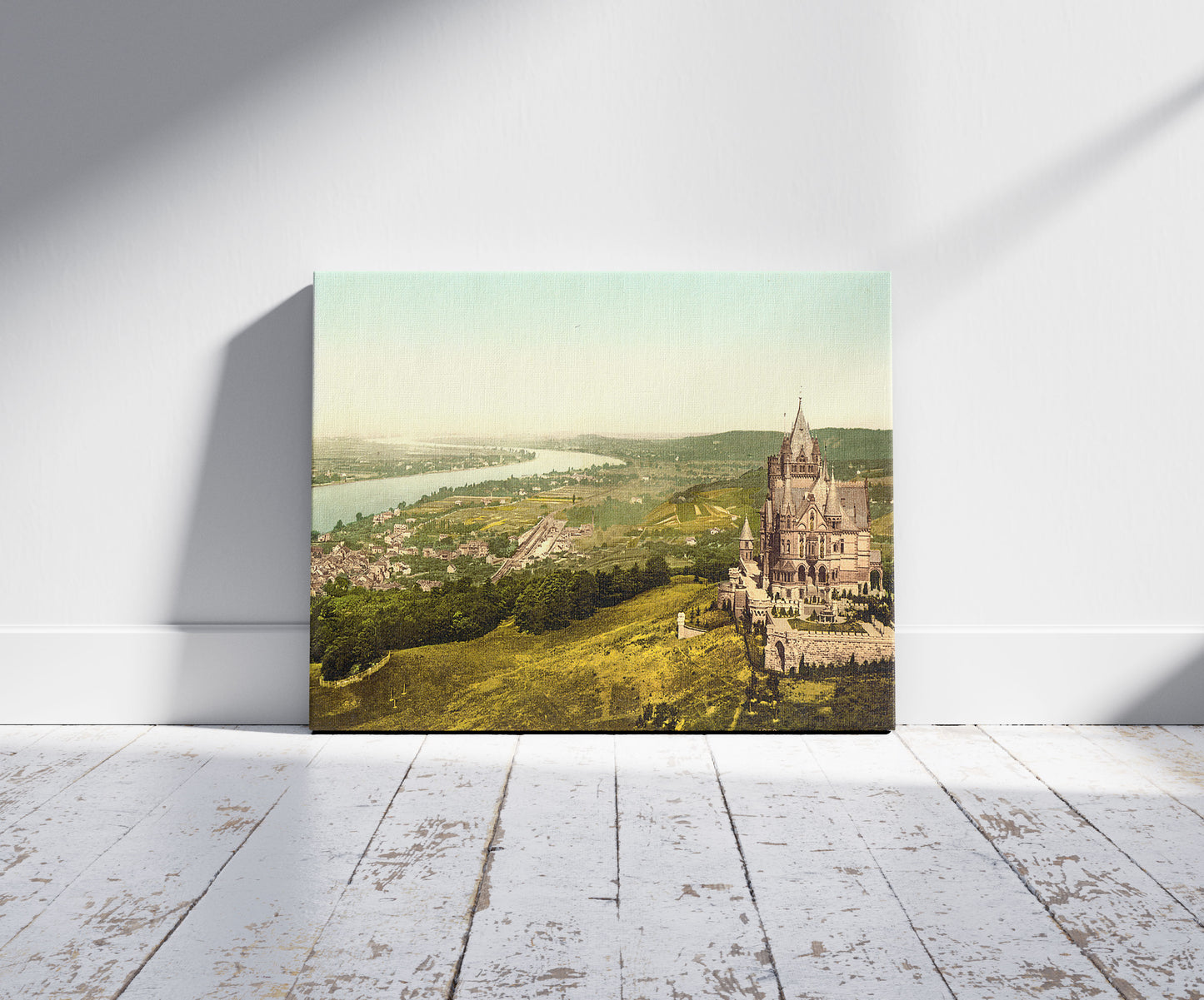 A picture of Drachenburg and Konigswinter, the Rhine, Germany, a mockup of the print leaning against a wall
