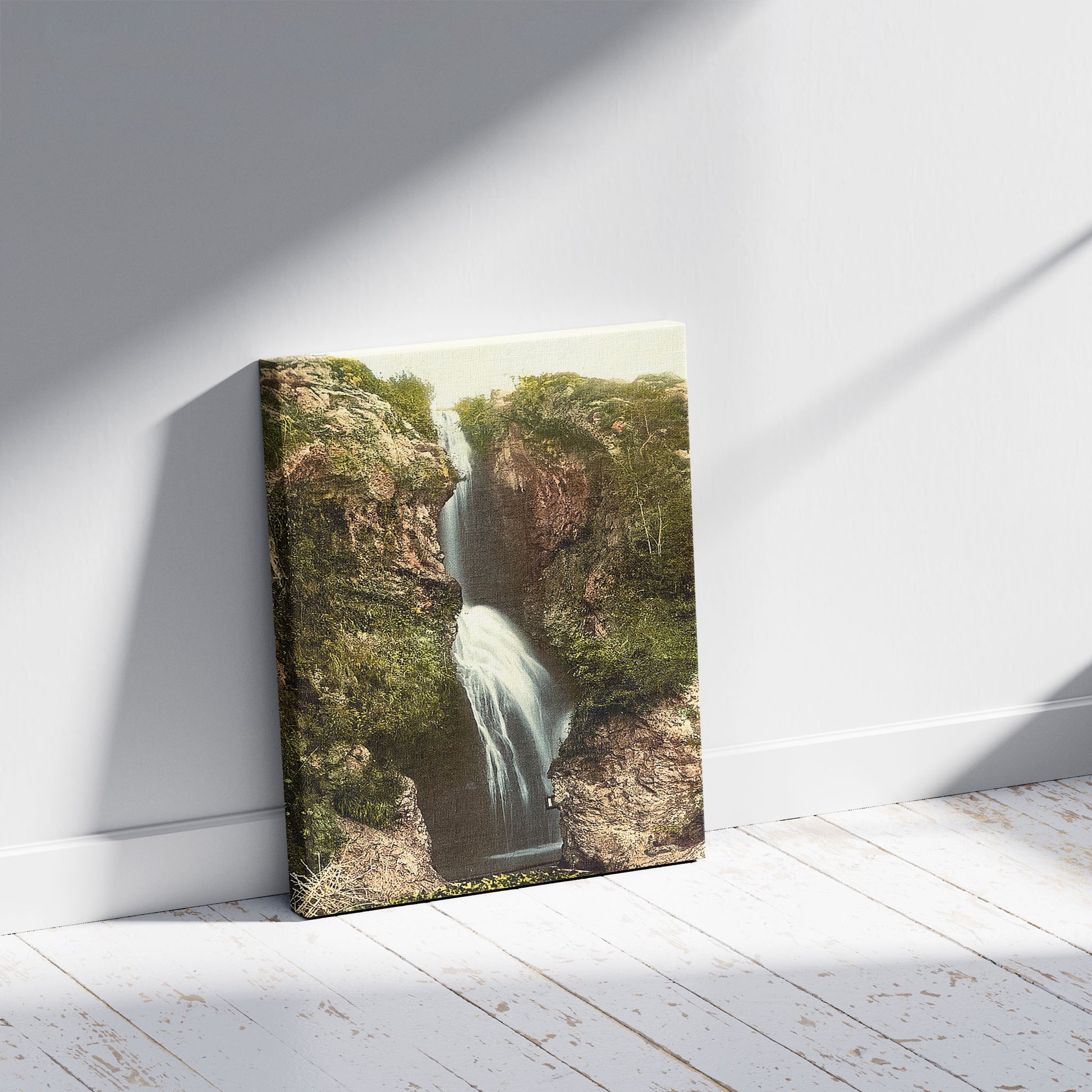 A picture of Dyserth Falls, Rhyl, Wales, a mockup of the print leaning against a wall