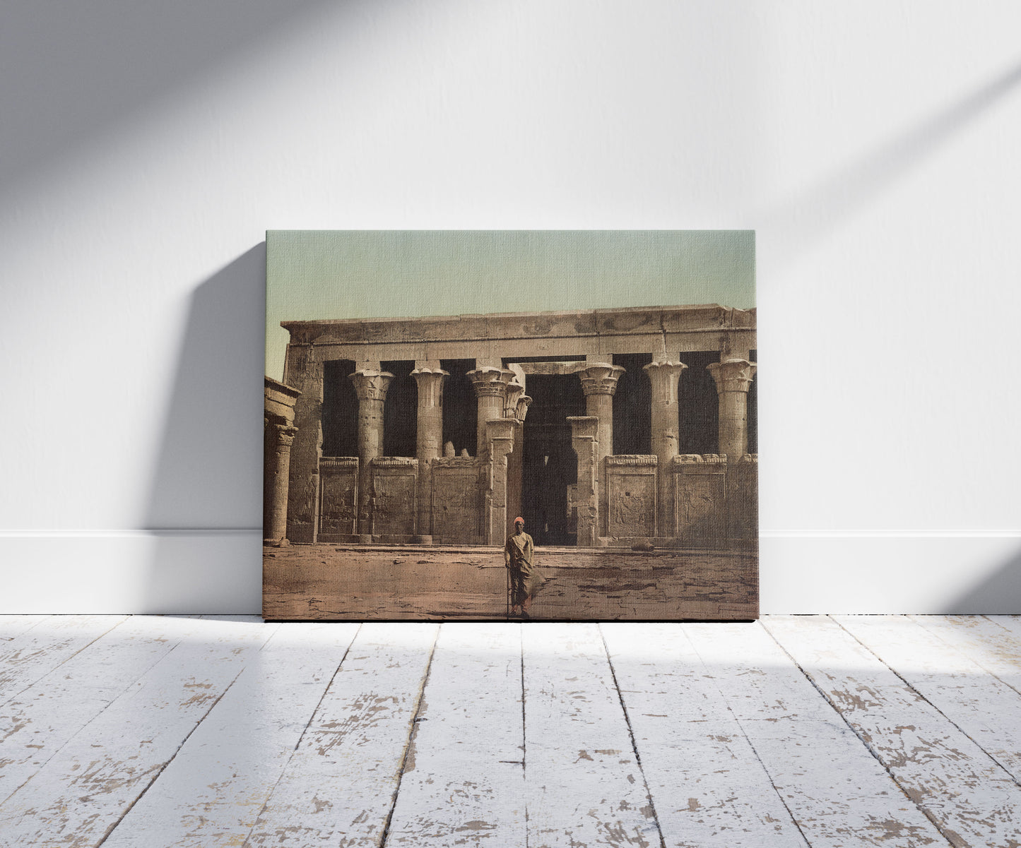 A picture of Edfoû. Les colonnes de Pronaos, a mockup of the print leaning against a wall