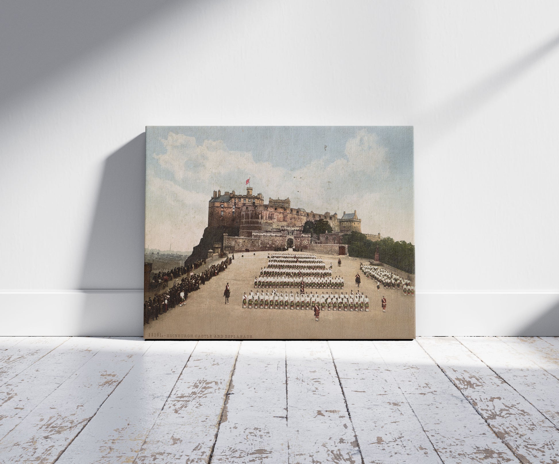 A picture of Edinburgh Castle and Esplanade, a mockup of the print leaning against a wall