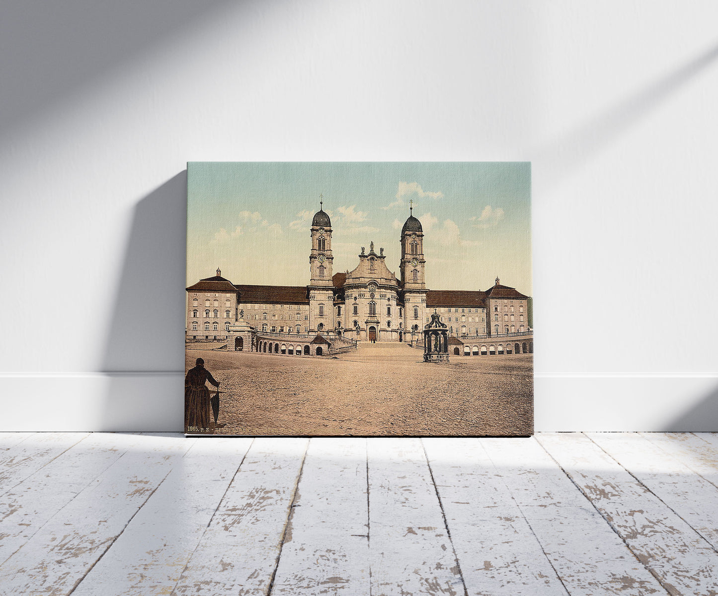 A picture of Einsiedeln, monastery, Lake Lucerne, Switzerland, a mockup of the print leaning against a wall