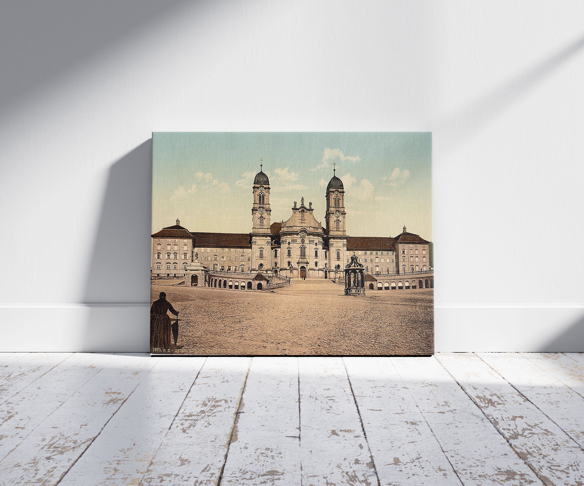 A picture of Einsiedeln, monastery, Lake Lucerne, Switzerland, a mockup of the print leaning against a wall