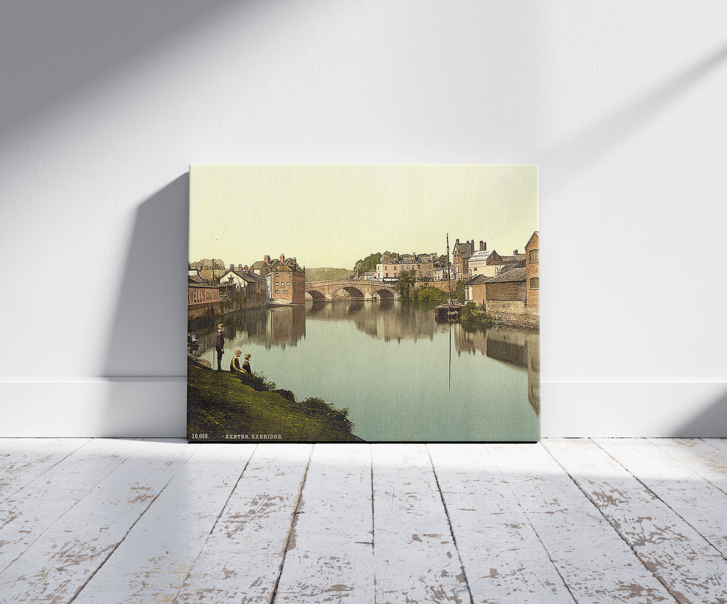 A picture of Exbridge, Exeter, England, a mockup of the print leaning against a wall