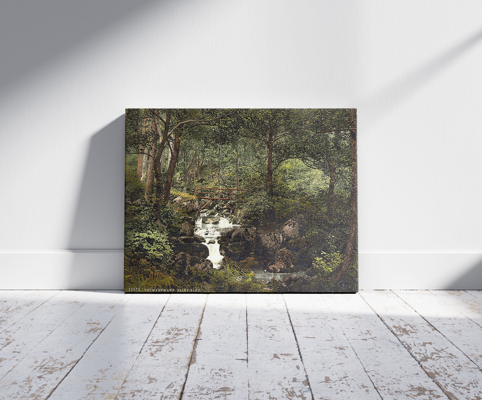 A picture of Fairy Glen Waterfall, Penmaenmawr, Wales, a mockup of the print leaning against a wall