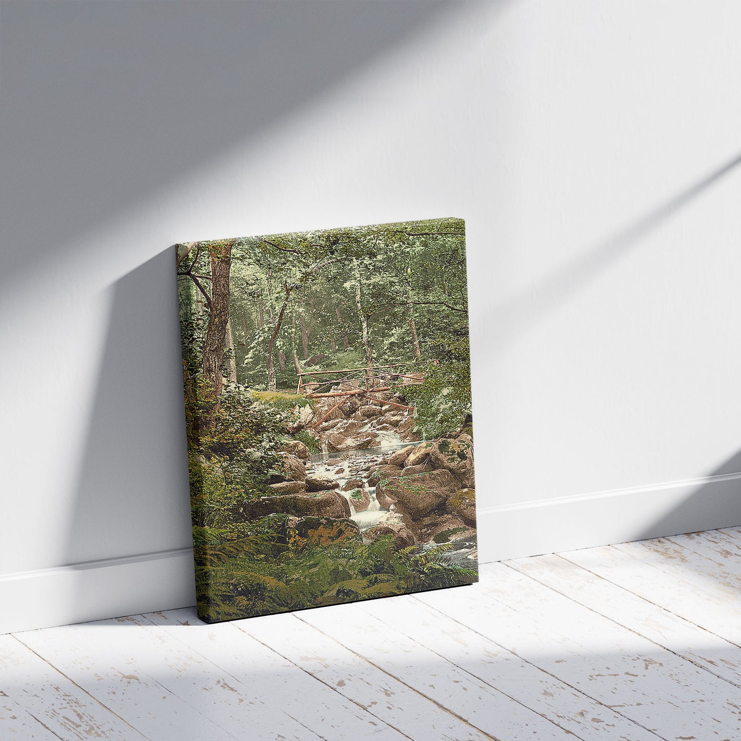 A picture of Fairy Glen Waterfall, the bridge, Penmaenmawr, Wales, a mockup of the print leaning against a wall