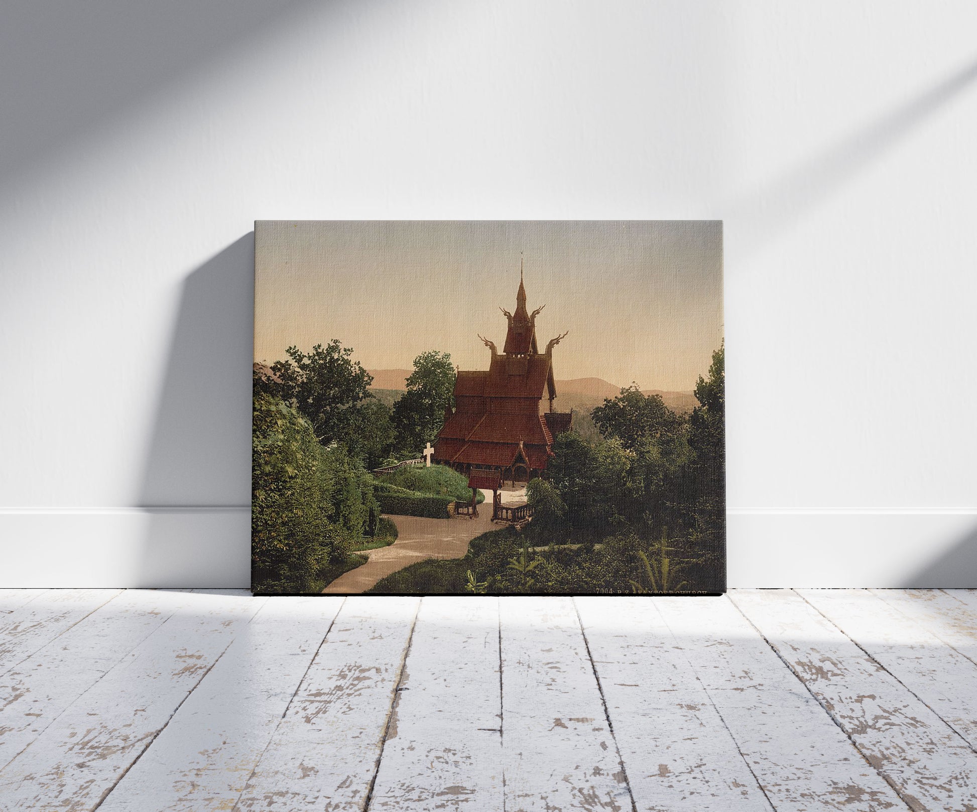 A picture of Fantoft Church, Bergen, Norway, a mockup of the print leaning against a wall