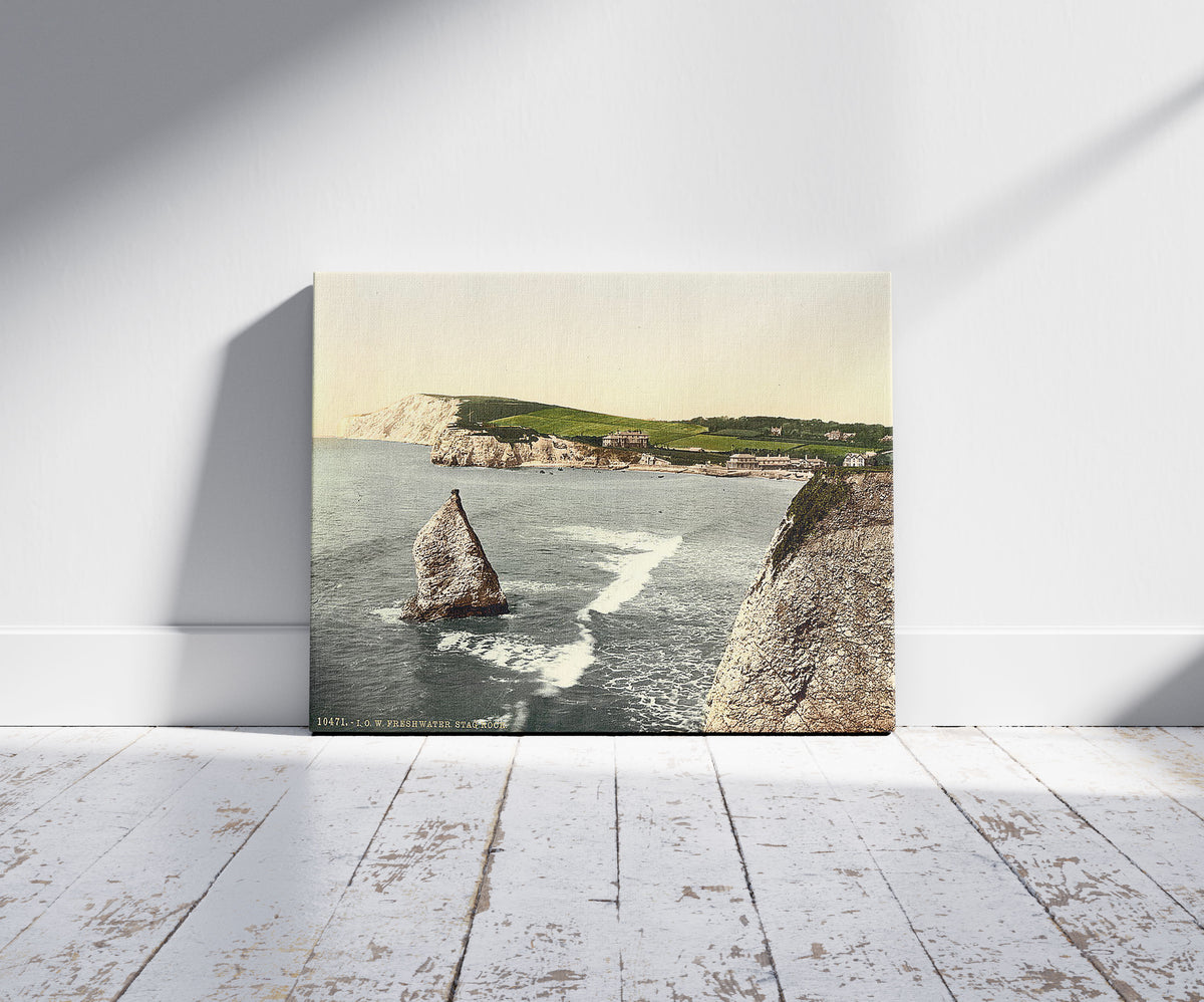 A picture of Freshwater Bay and Stag Rock, Isle of Wight, England, a mockup of the print leaning against a wall