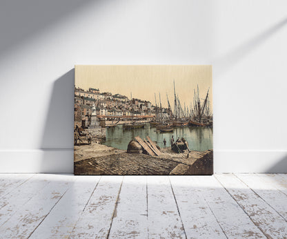 A picture of From the Harbor, Brixham, England, a mockup of the print leaning against a wall