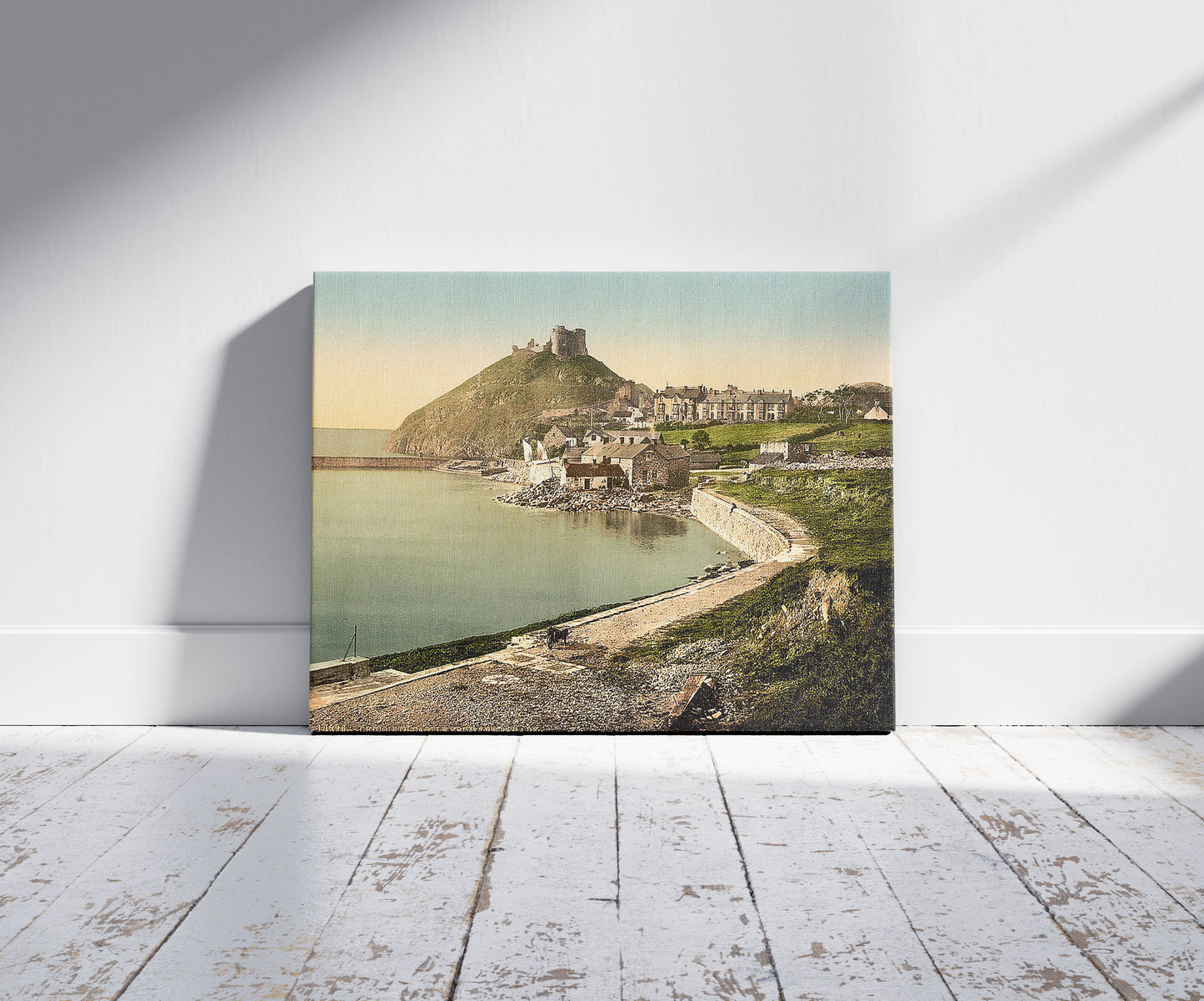 A picture of From the parade, Criccieth Castle, Wales, a mockup of the print leaning against a wall