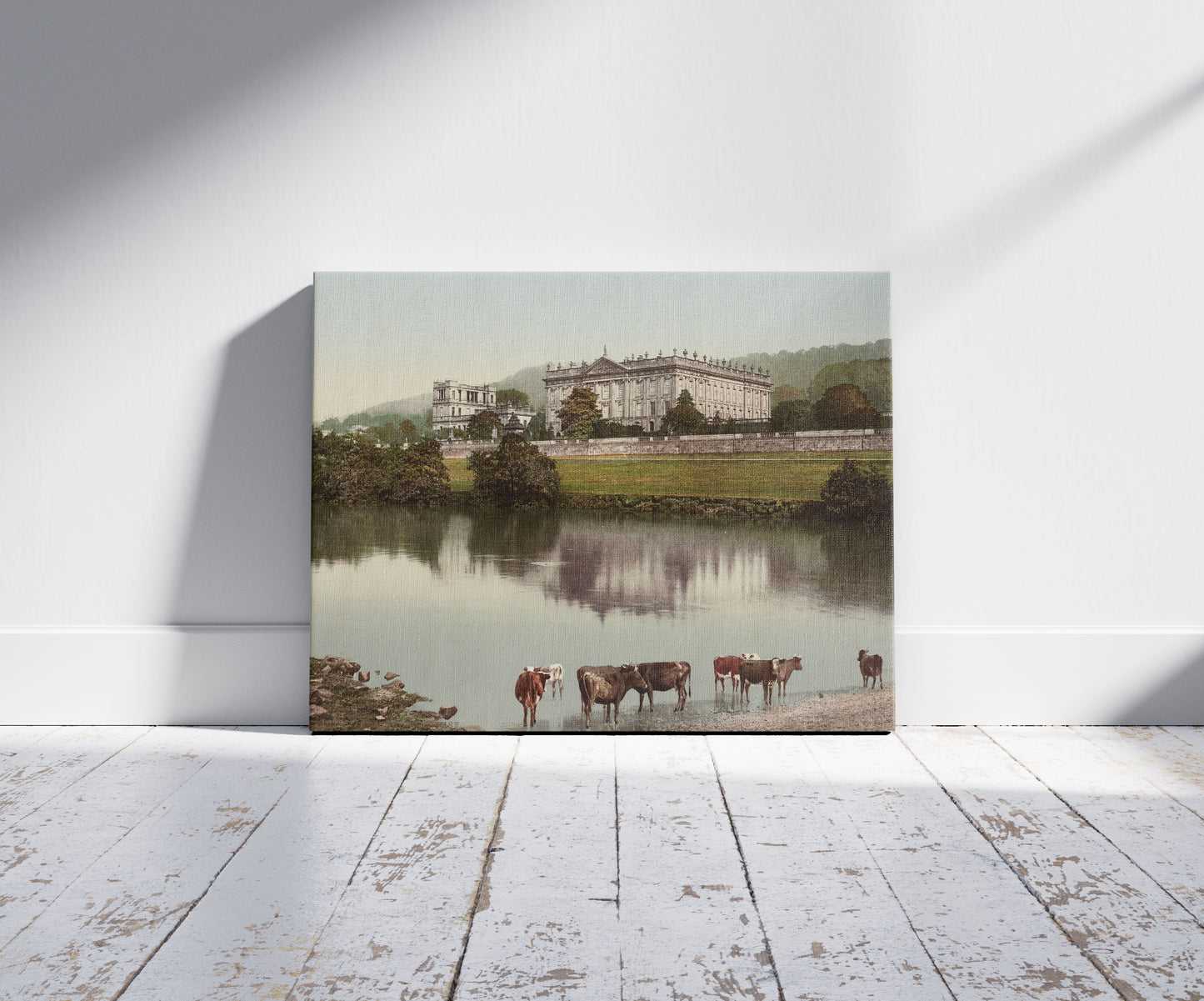 A picture of Front view of Chatsworth House, Chatsworth, England, a mockup of the print leaning against a wall