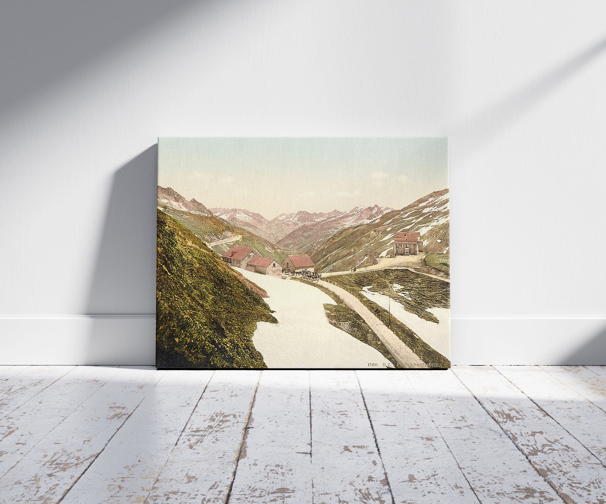 A picture of Fuka Pass, Bernese Oberland, Switzerland, a mockup of the print leaning against a wall