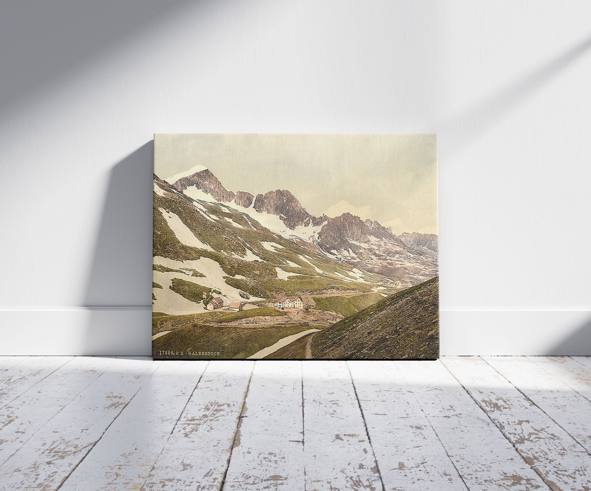 A picture of Furka Pass, Galenstock, general view, Bernese Oberland, Switzerland, a mockup of the print leaning against a wall