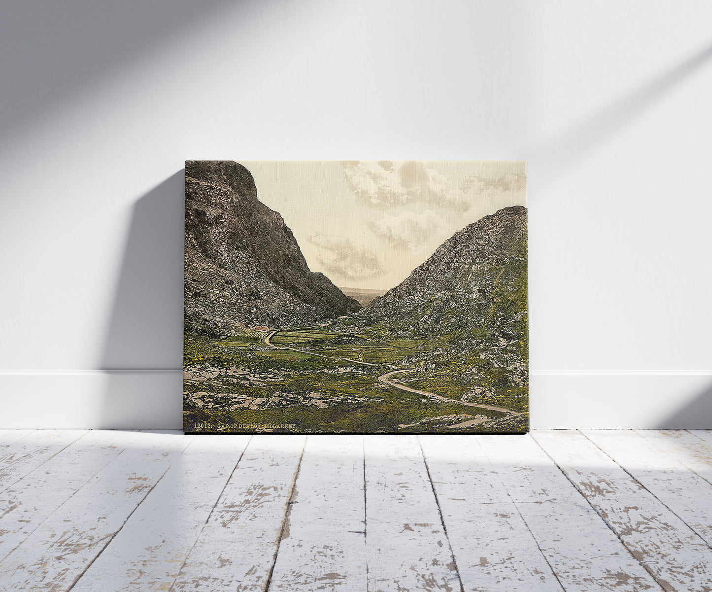 A picture of Gap of Dunloe, Killarney. County Kerry, Ireland, a mockup of the print leaning against a wall