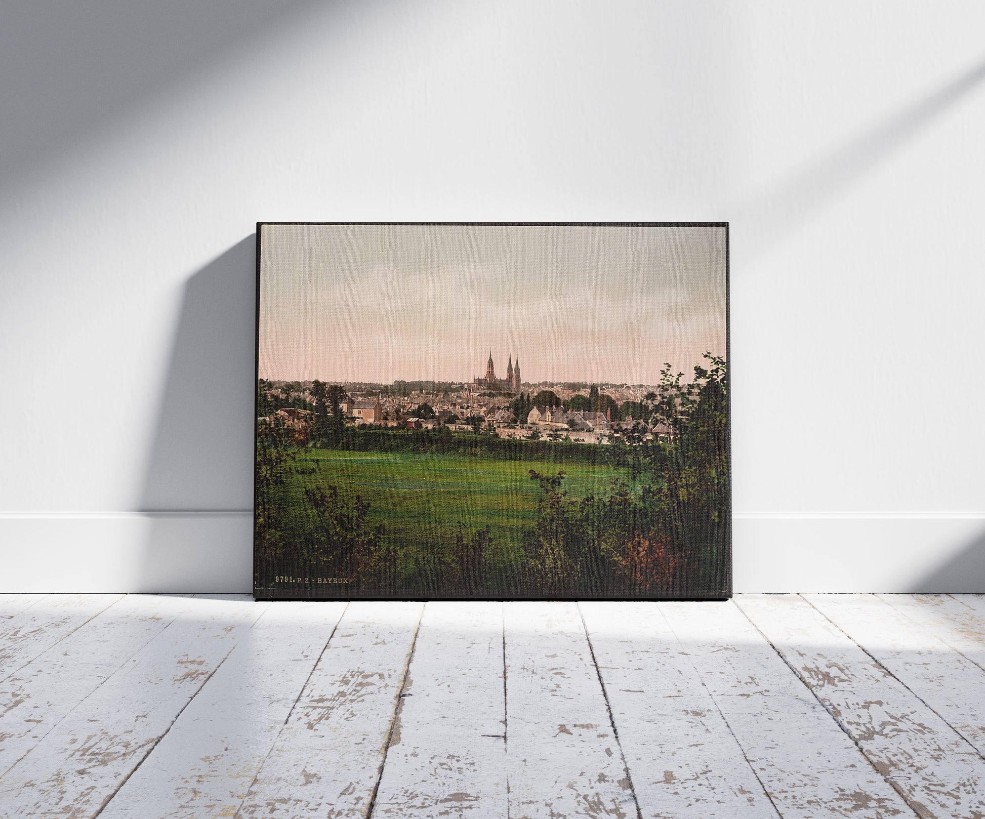 A picture of General view, Bayeux, France, a mockup of the print leaning against a wall