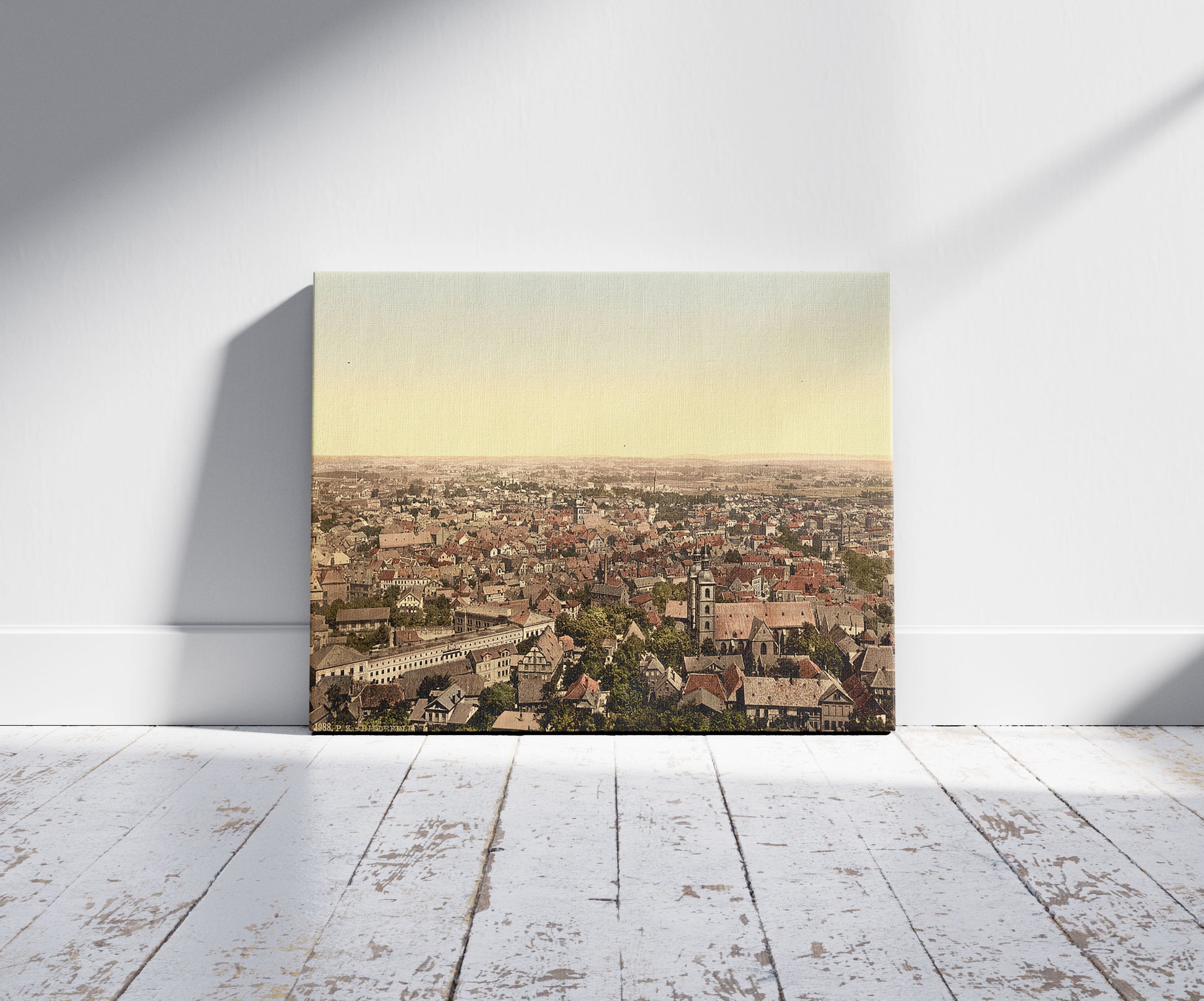 A picture of General view, Bielefield (i.e., Bielefeld), Westphalia, Germany, a mockup of the print leaning against a wall