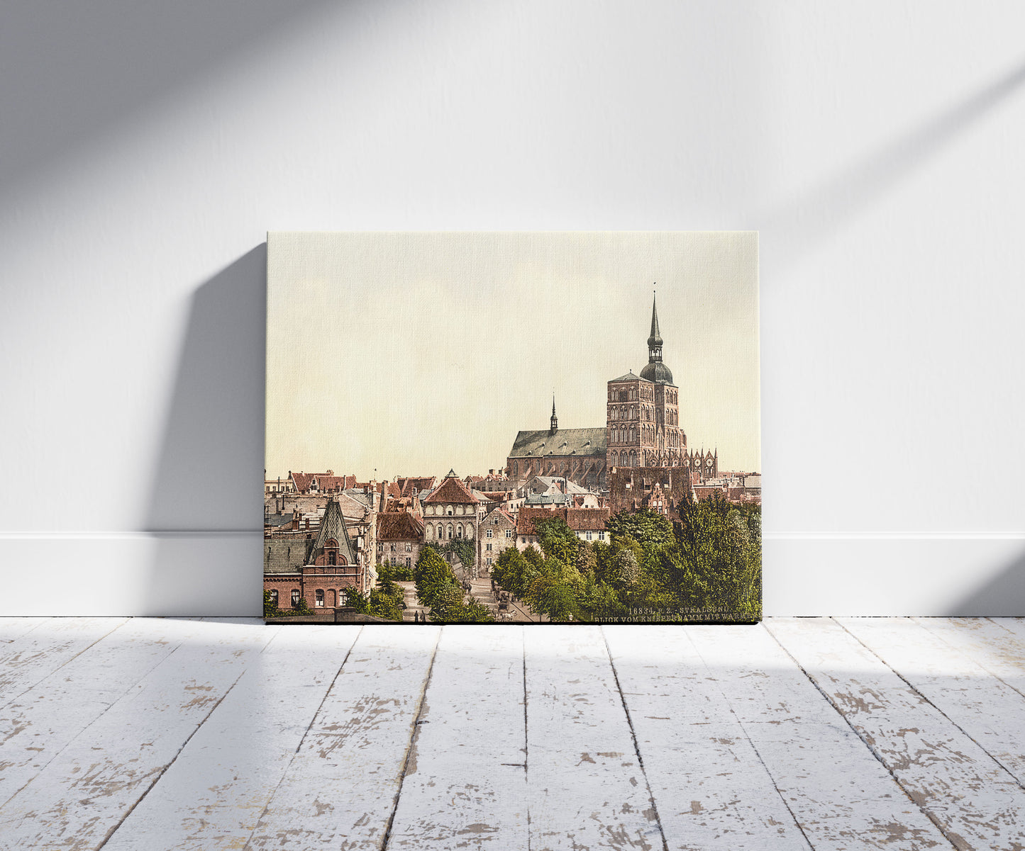 A picture of General view, from Knieperdamm, showing warm baths, Stralsund, Pomerania, Germany, a mockup of the print leaning against a wall