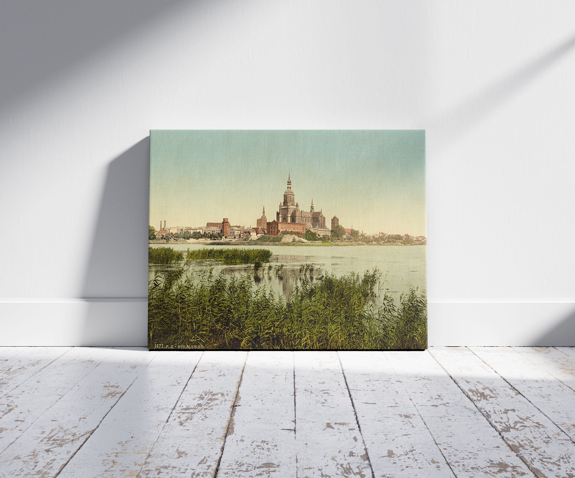 A picture of General view, from station, Stralsund, Pomerania, Germany, a mockup of the print leaning against a wall