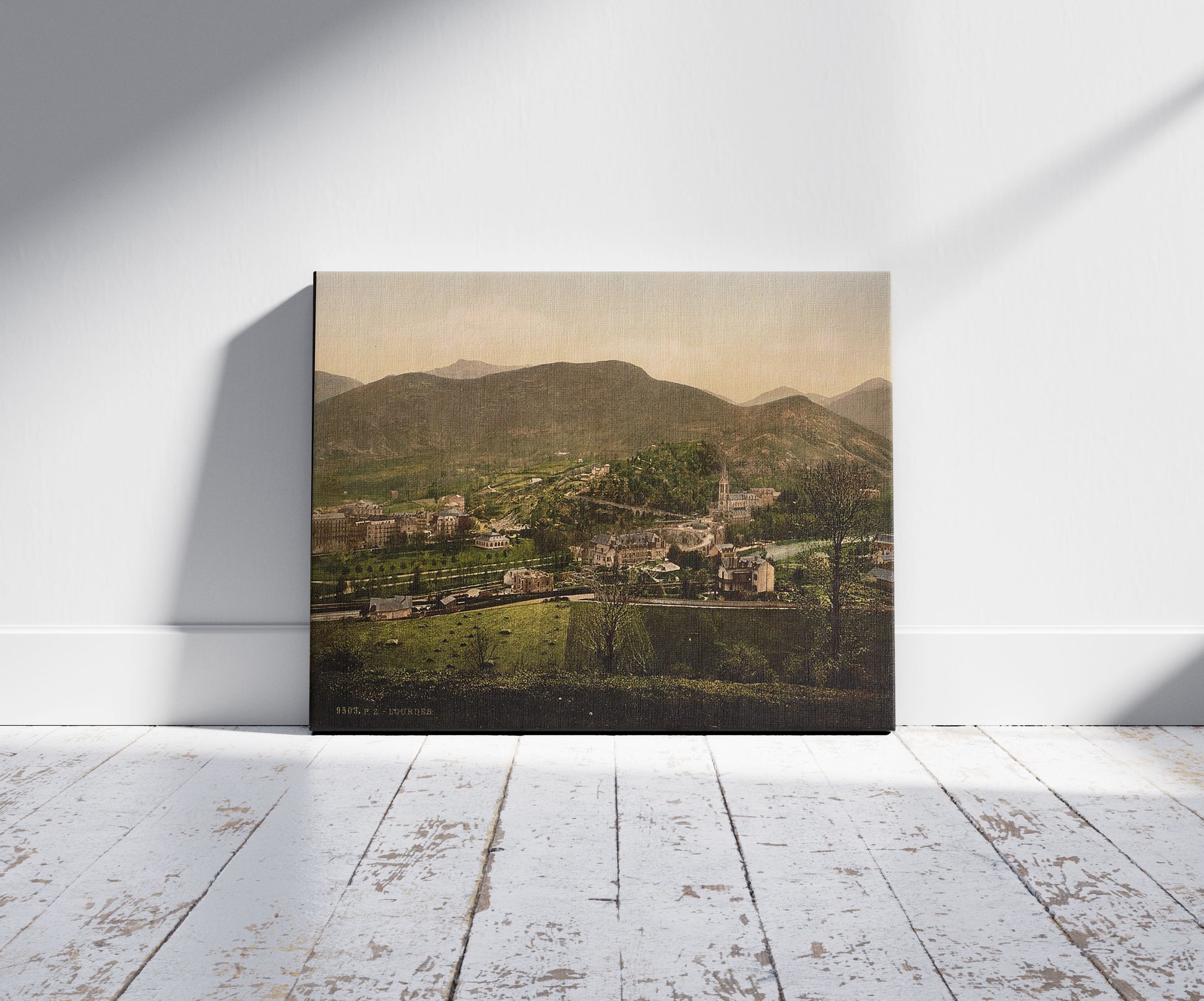 A picture of General view, Lourdes, Pyrenees, France, a mockup of the print leaning against a wall