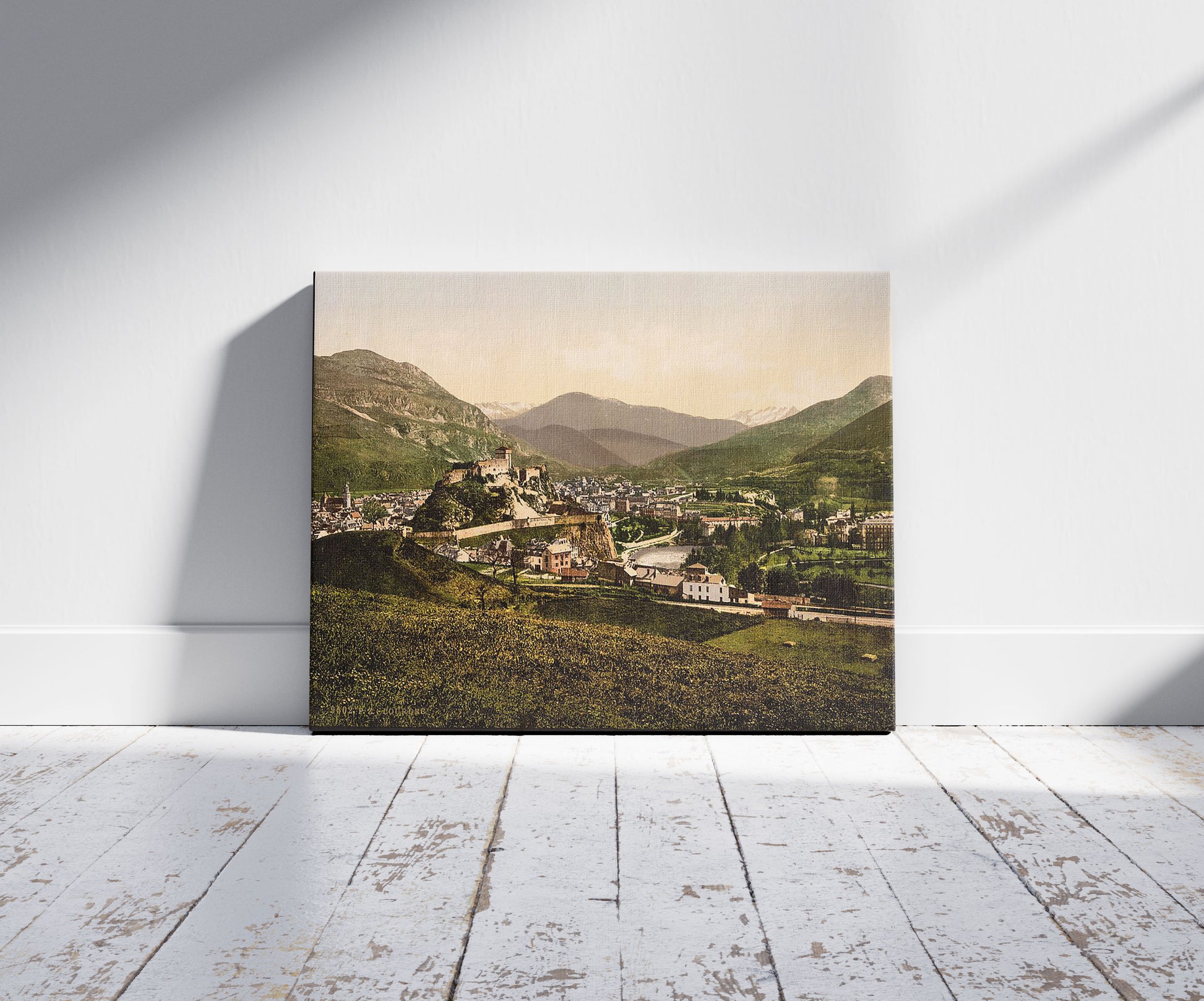 A picture of General view, Lourdes, Pyrenees, France, a mockup of the print leaning against a wall