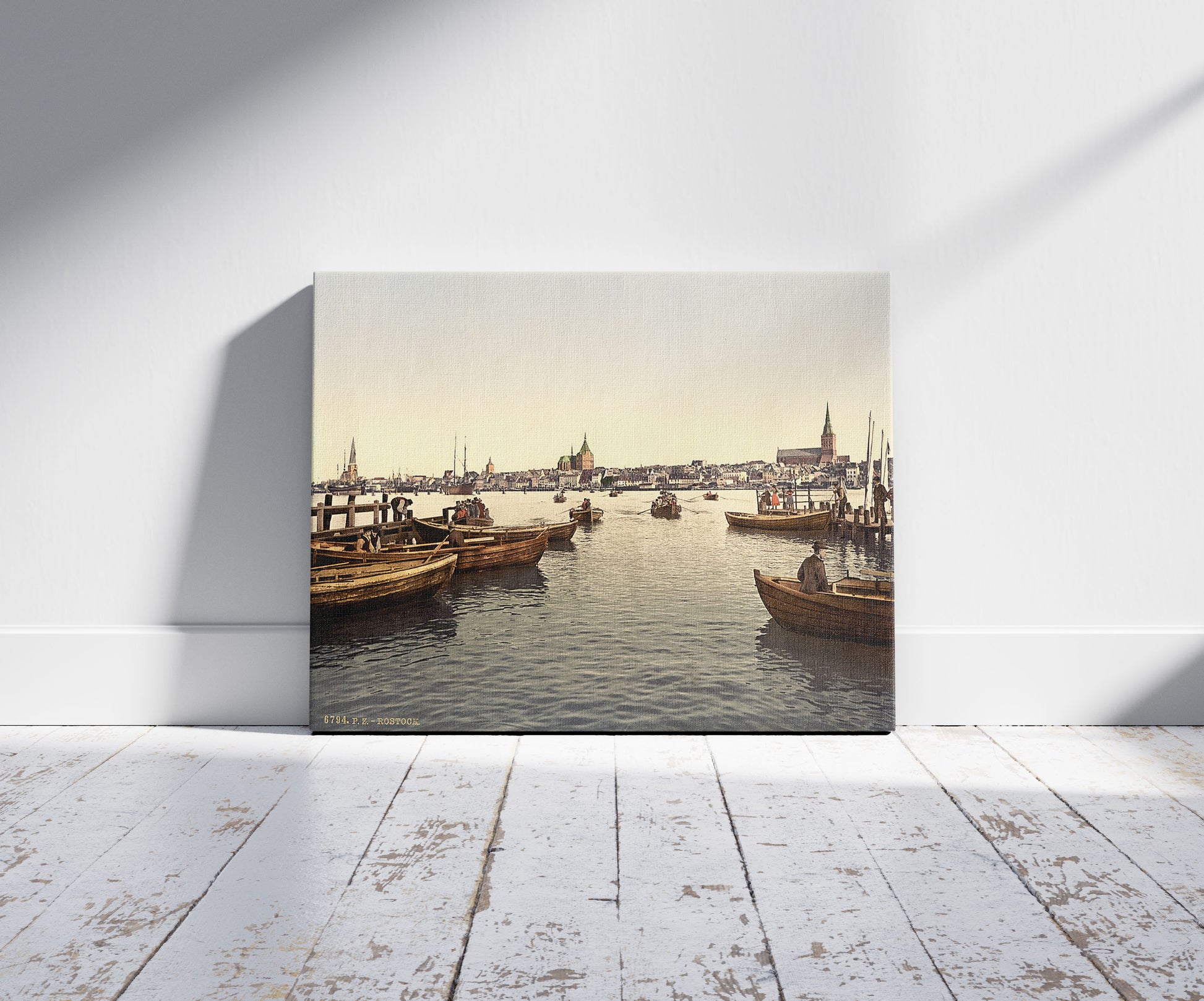 A picture of General view, Rostock, Mecklenburg-Schwern, Germany, a mockup of the print leaning against a wall