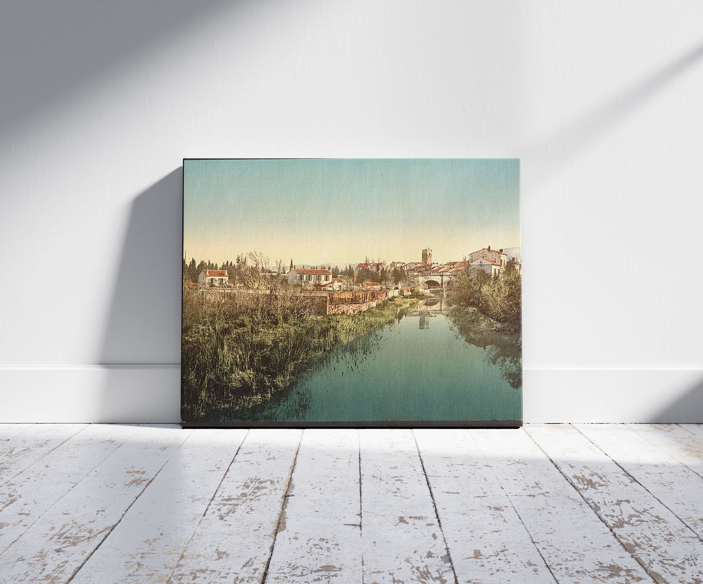 A picture of General view with the cathedral, San Raphael (i.e. San Raffaele), Italy, a mockup of the print leaning against a wall