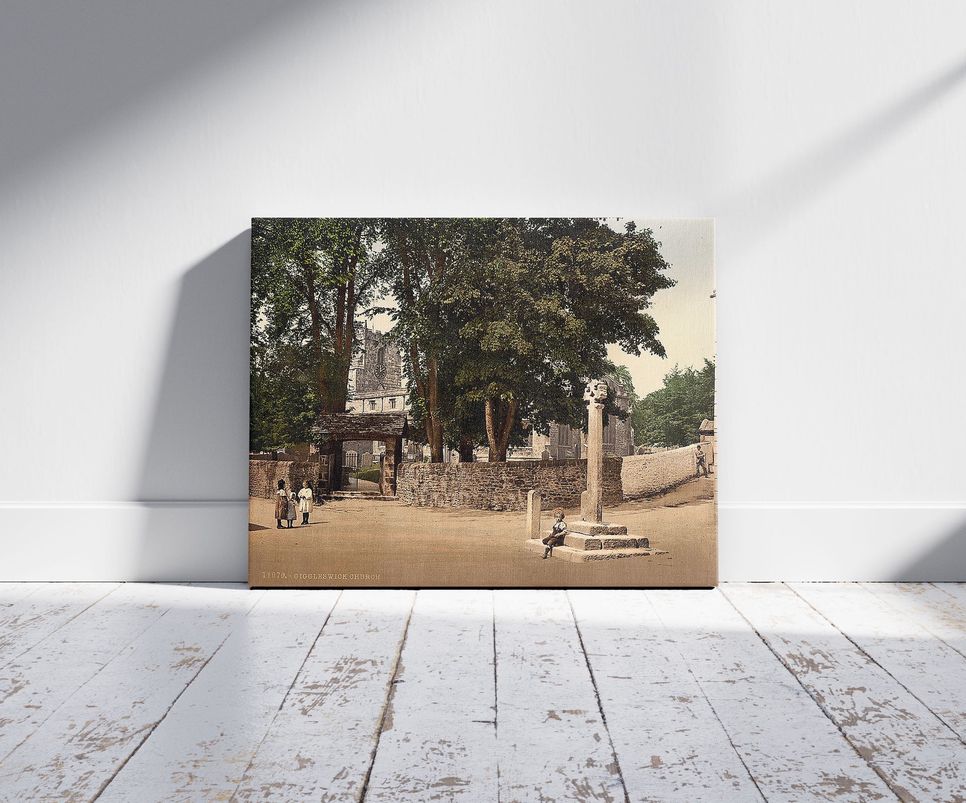 A picture of Giggleswick Church, Yorkshire, England, a mockup of the print leaning against a wall