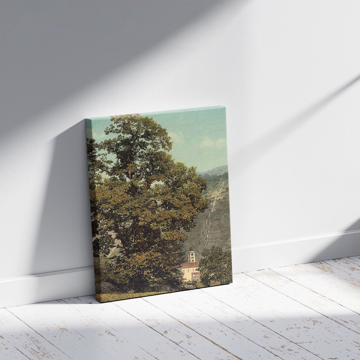 A picture of Giornico, church and waterfall, St. Gotthard Railway, Switzerland, a mockup of the print leaning against a wall