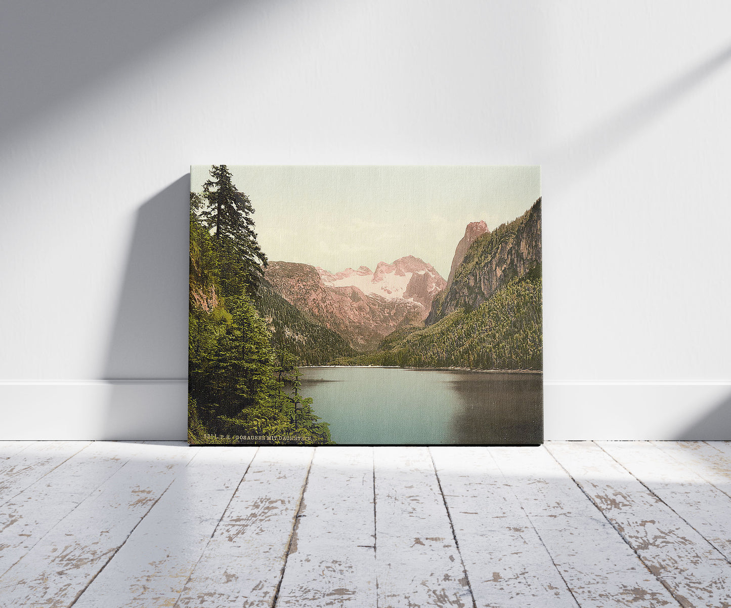 A picture of Gosausee and Dachstein, Upper Austria, Austro-Hungary, a mockup of the print leaning against a wall