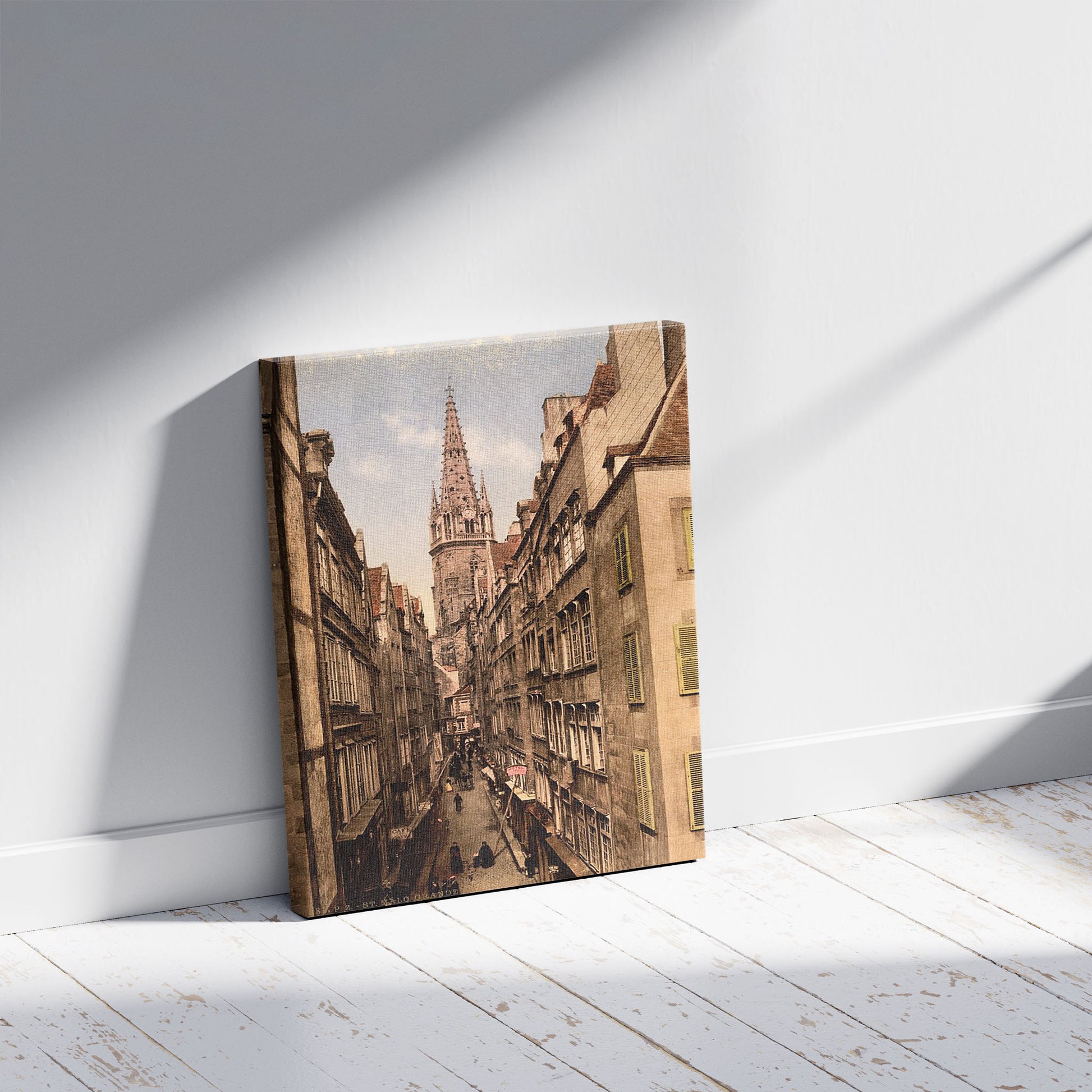 A picture of Grand Street, St. Malo, France, a mockup of the print leaning against a wall