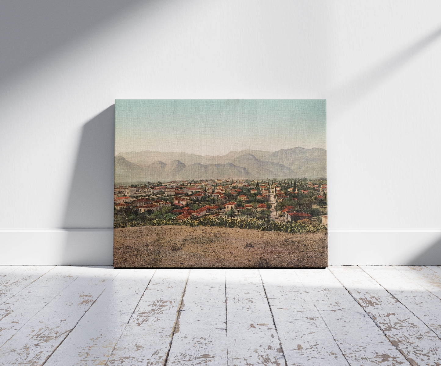 A picture of Grèce. Vue de Sparte Avec le Taygete, a mockup of the print leaning against a wall