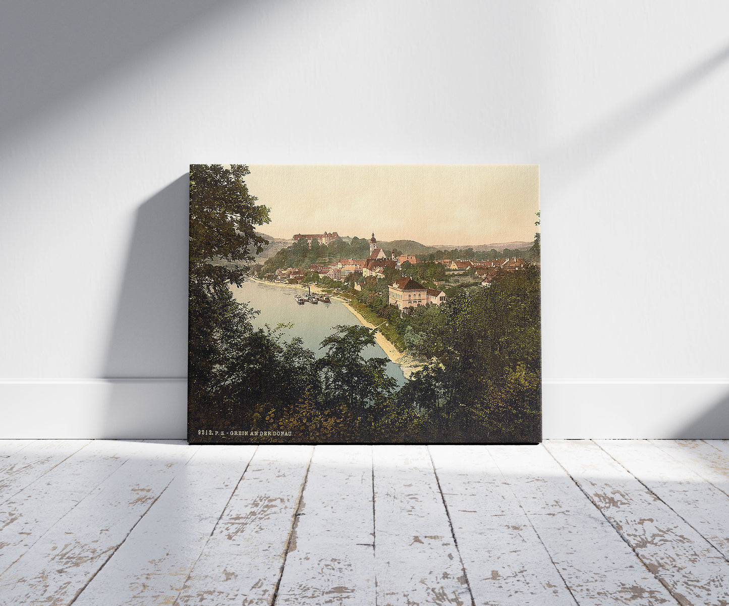 A picture of Grein, Upper Austria, Austro-Hungary, a mockup of the print leaning against a wall