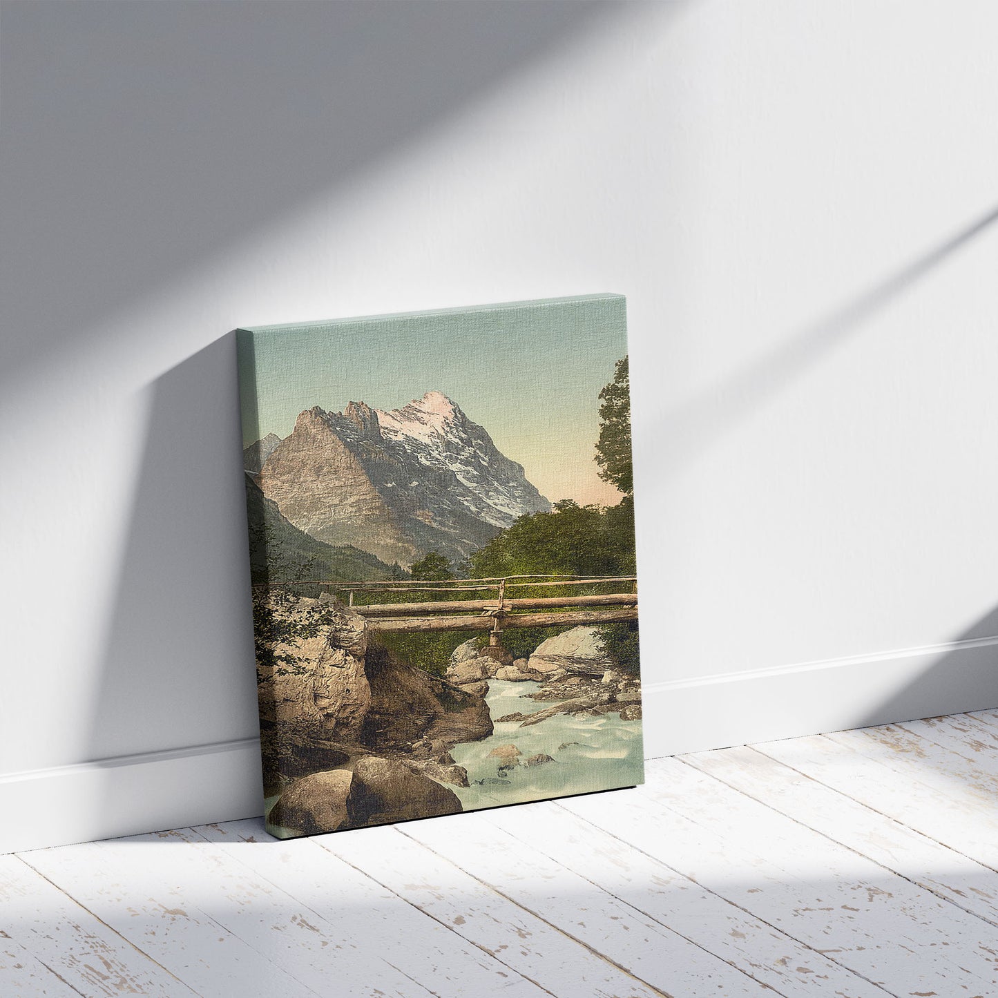 A picture of Grindelwald, with Eiger, Bernese Oberland, Switzerland, a mockup of the print leaning against a wall