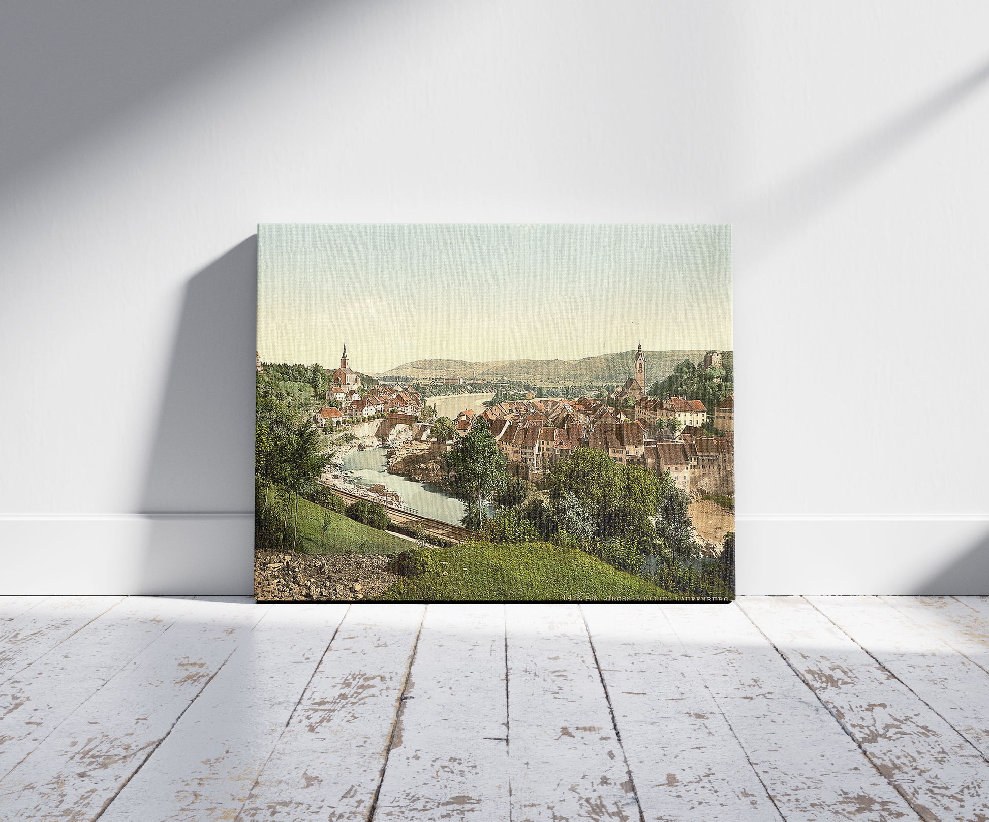 A picture of Gross and Klein Laufenburg, Aargau, Switzerland, a mockup of the print leaning against a wall