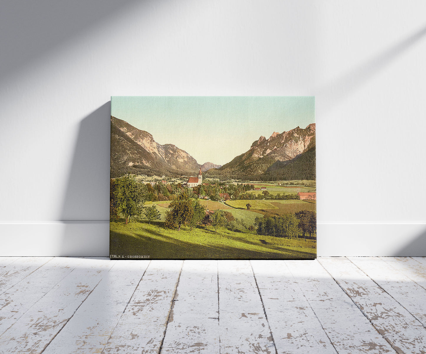 A picture of Grossgmein (i.e., Gross-Gmain), near the baths of Reichenhall, Salzburg, Austro-Hungary, a mockup of the print leaning against a wall