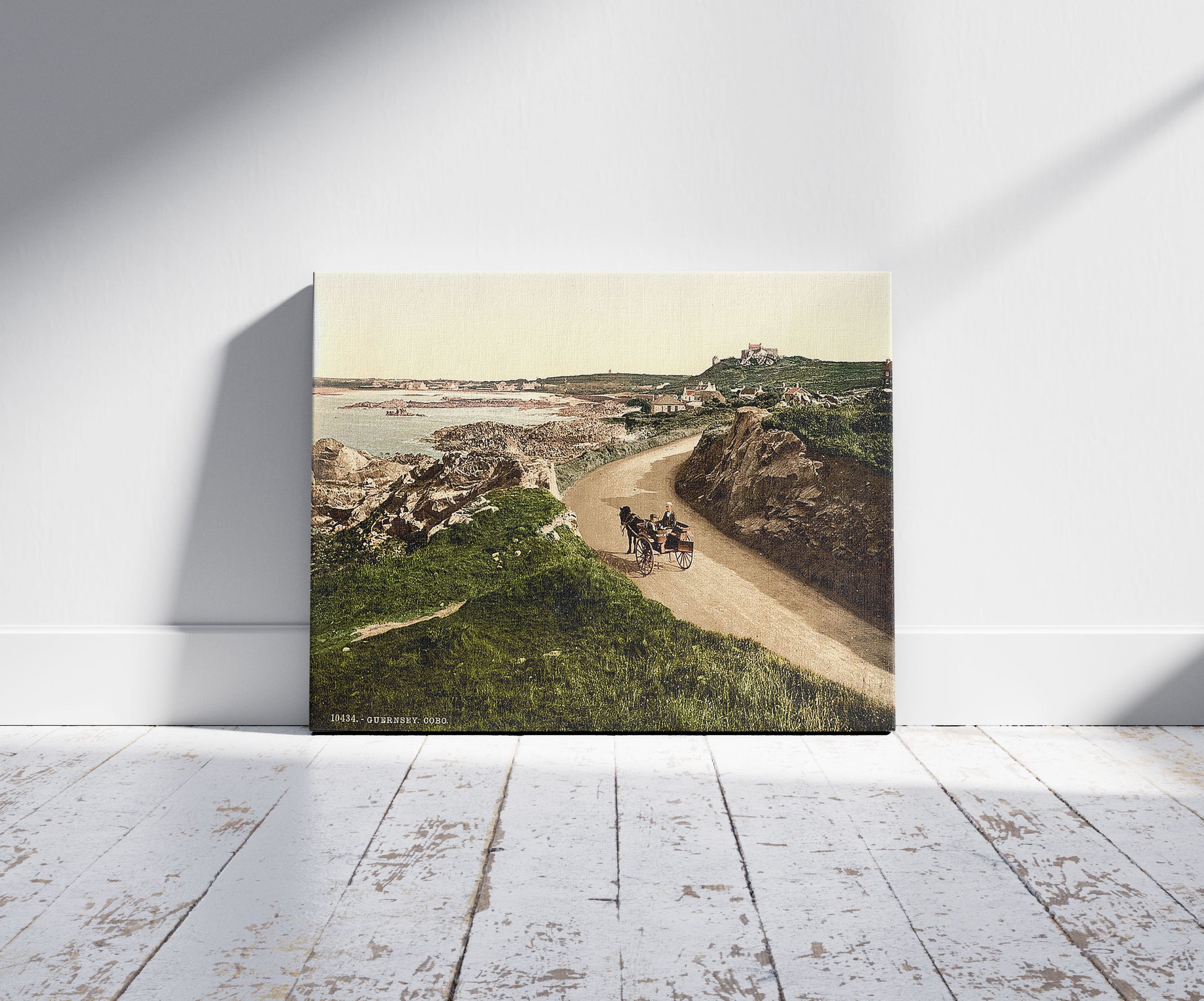 A picture of Guernsey, Cobo, Channel Islands, a mockup of the print leaning against a wall