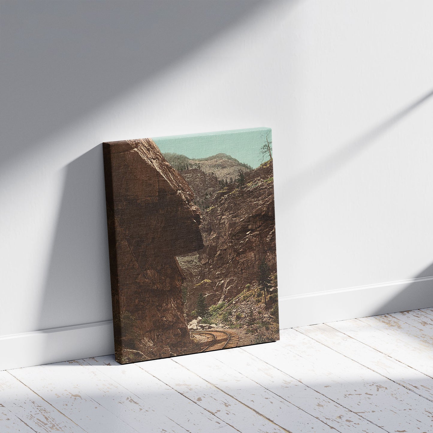 A picture of Hanging Rock, Clear Creek Cañon, a mockup of the print leaning against a wall