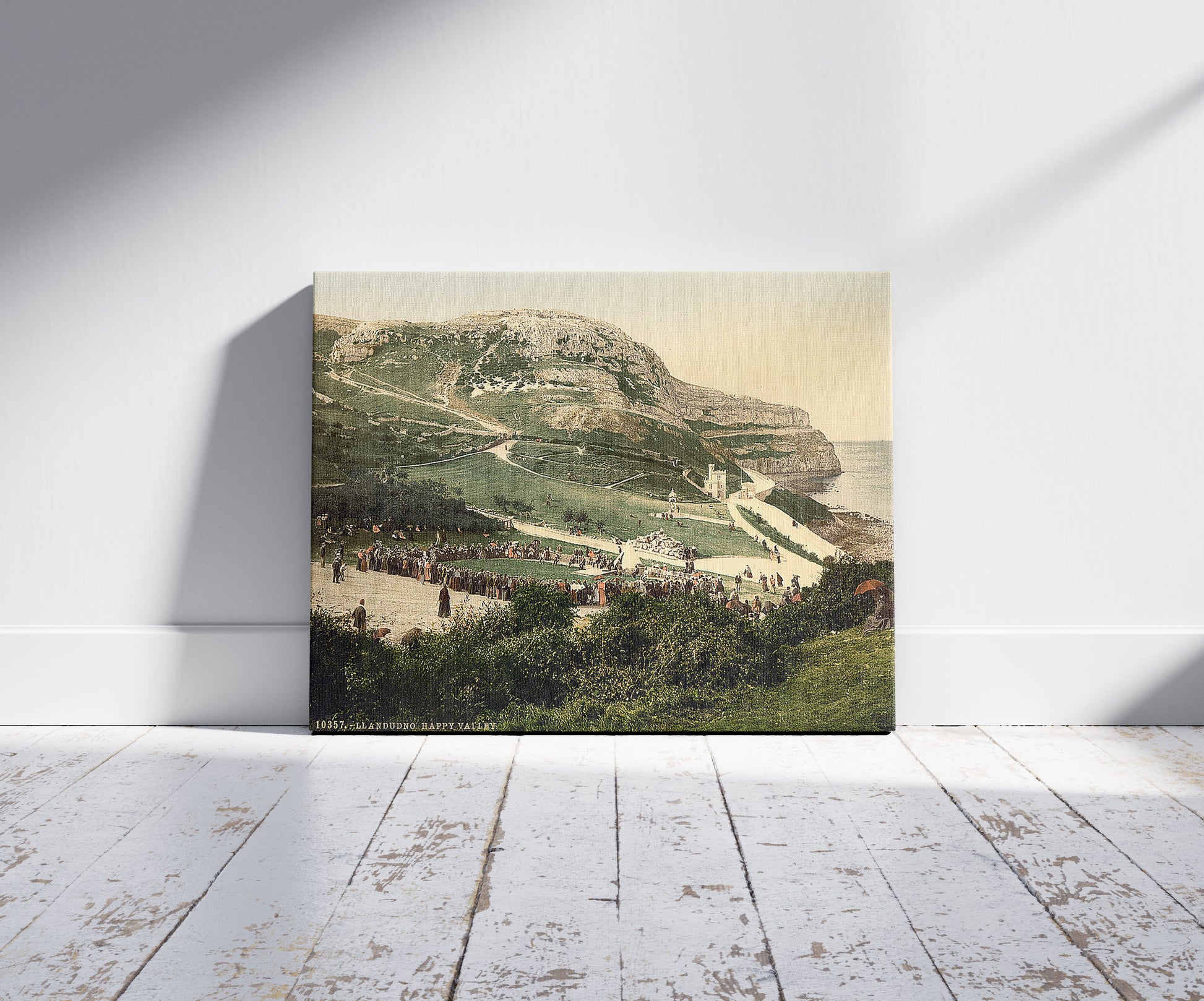 A picture of Happy Valley, Llandudno, Wales, a mockup of the print leaning against a wall