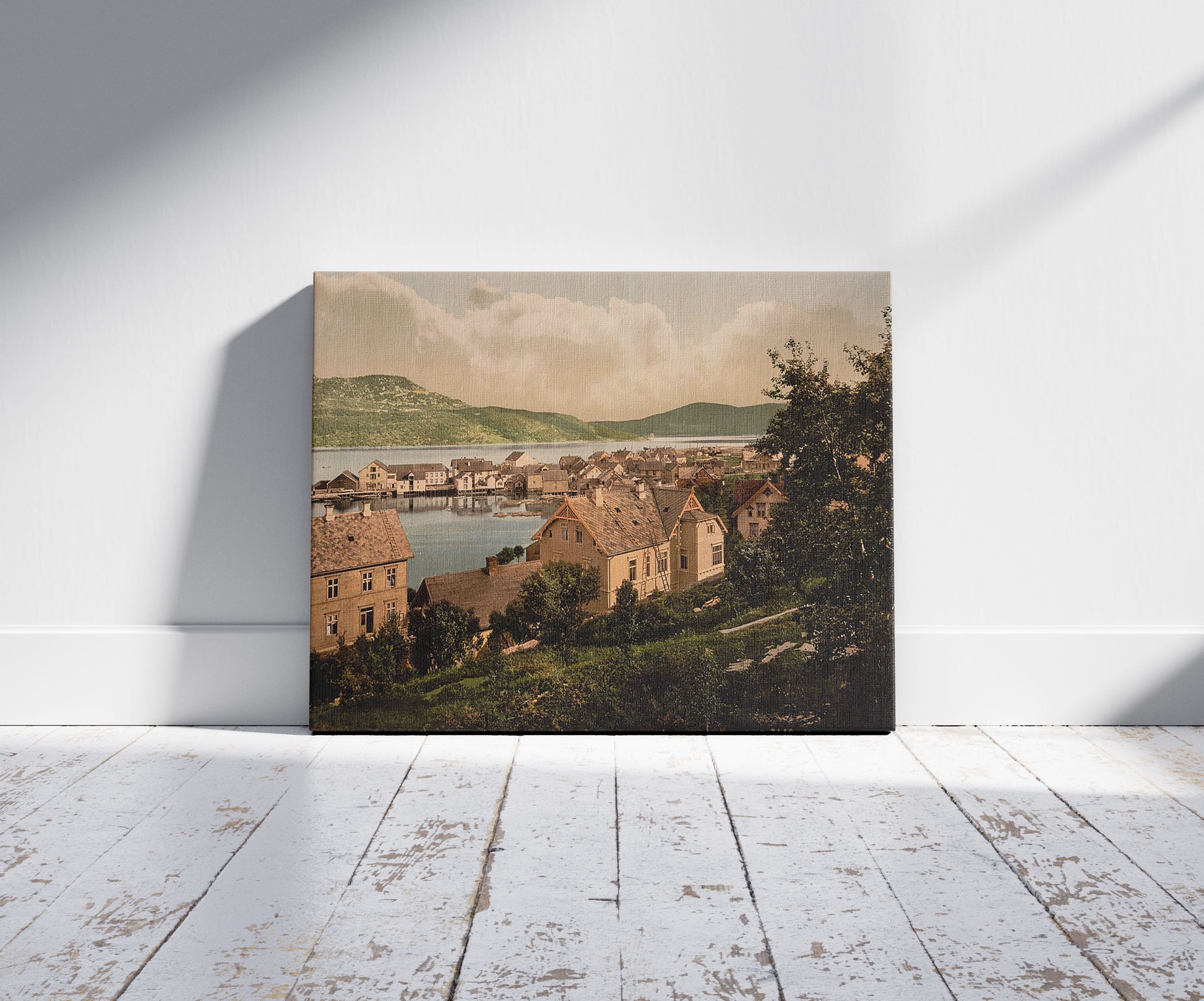 A picture of Harstadhavn (i.e., Harstad harbor), Norway, a mockup of the print leaning against a wall
