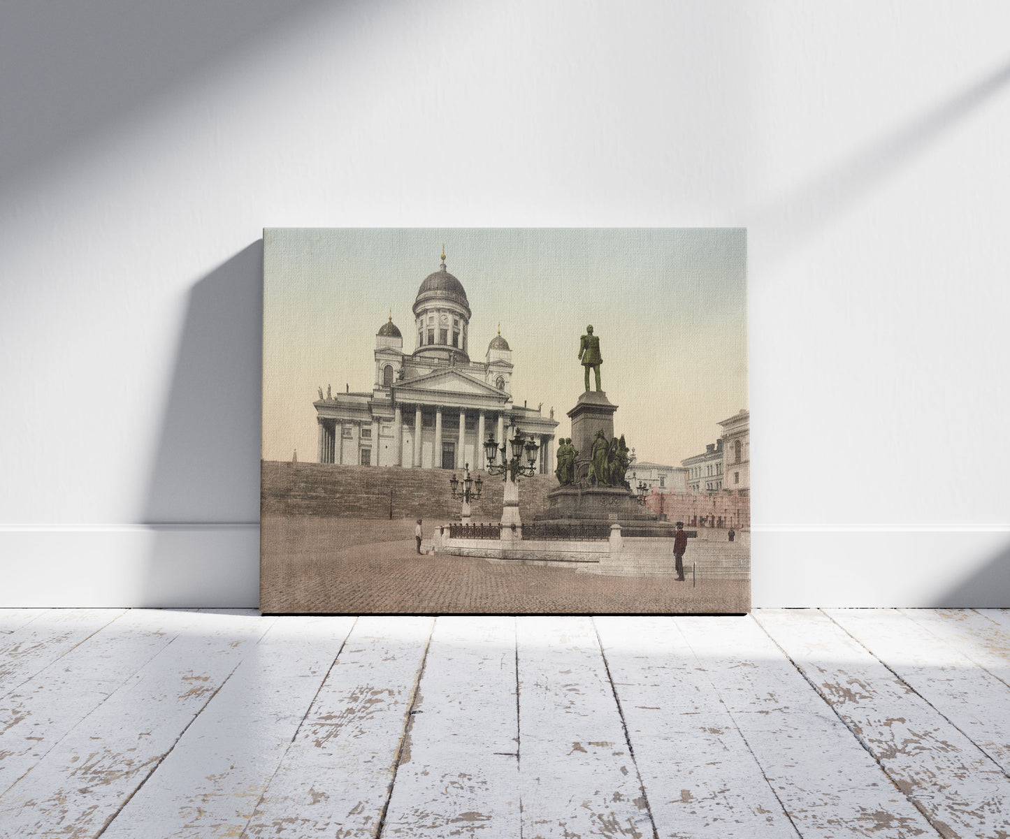 A picture of Helsingfors. L'Monument D'Alexandre II, a mockup of the print leaning against a wall