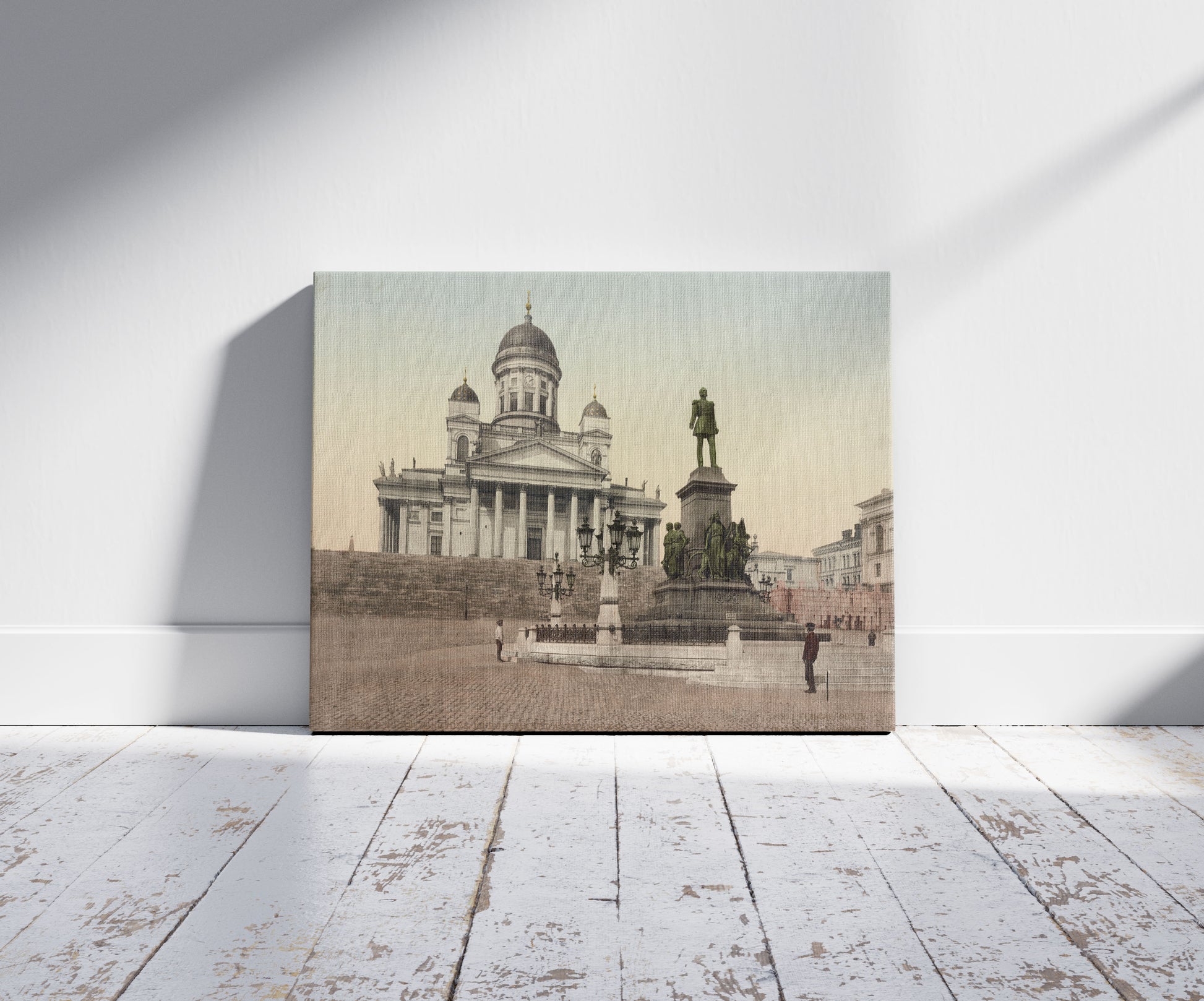A picture of Helsingfors. L'Monument D'Alexandre II, a mockup of the print leaning against a wall