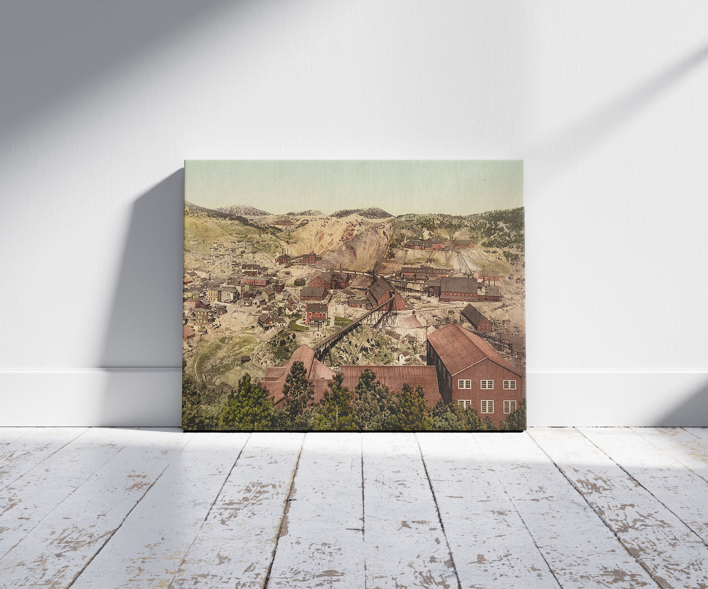 A picture of Homestake Mine, South Dakota, a mockup of the print leaning against a wall