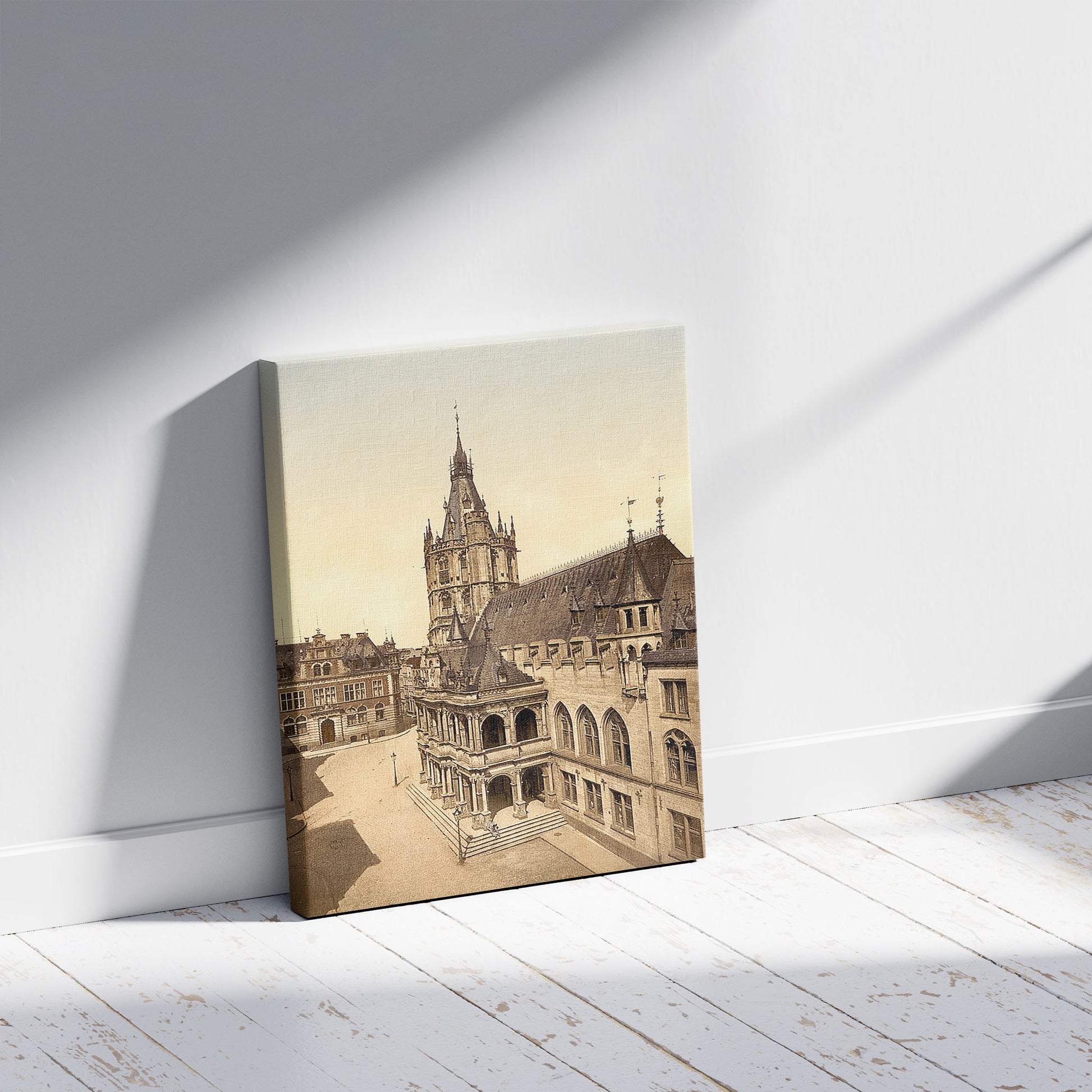 A picture of Hotel de Ville, Cologne, the Rhine, Germany, a mockup of the print leaning against a wall